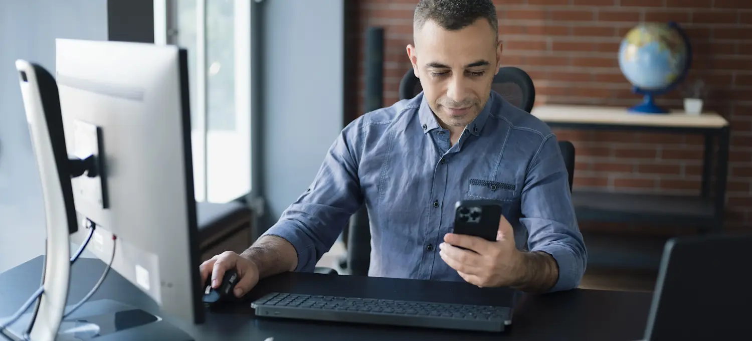 [Featured Image] A business person in their office is learning how to invest in the metaverse.