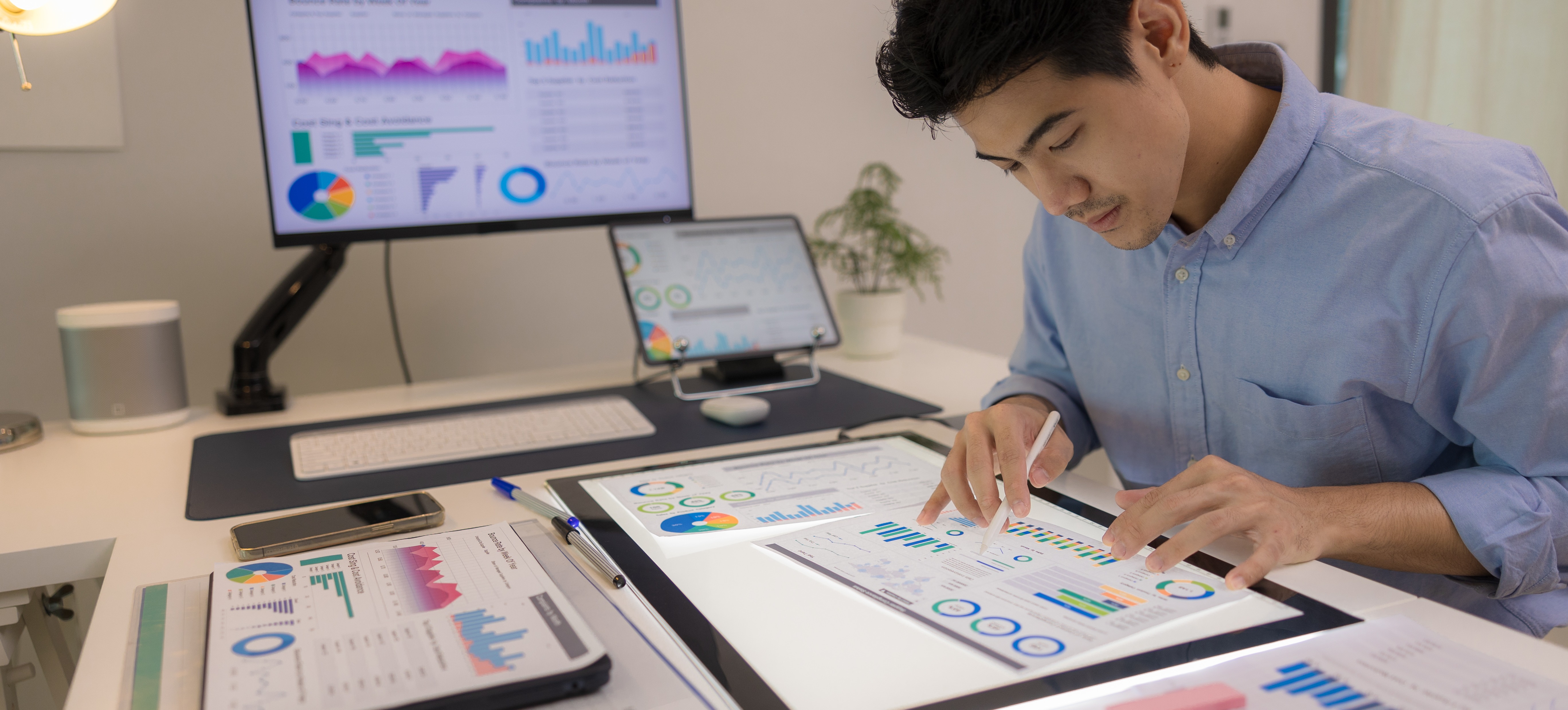 [Featured Image] A research analyst examines data for accuracy. 