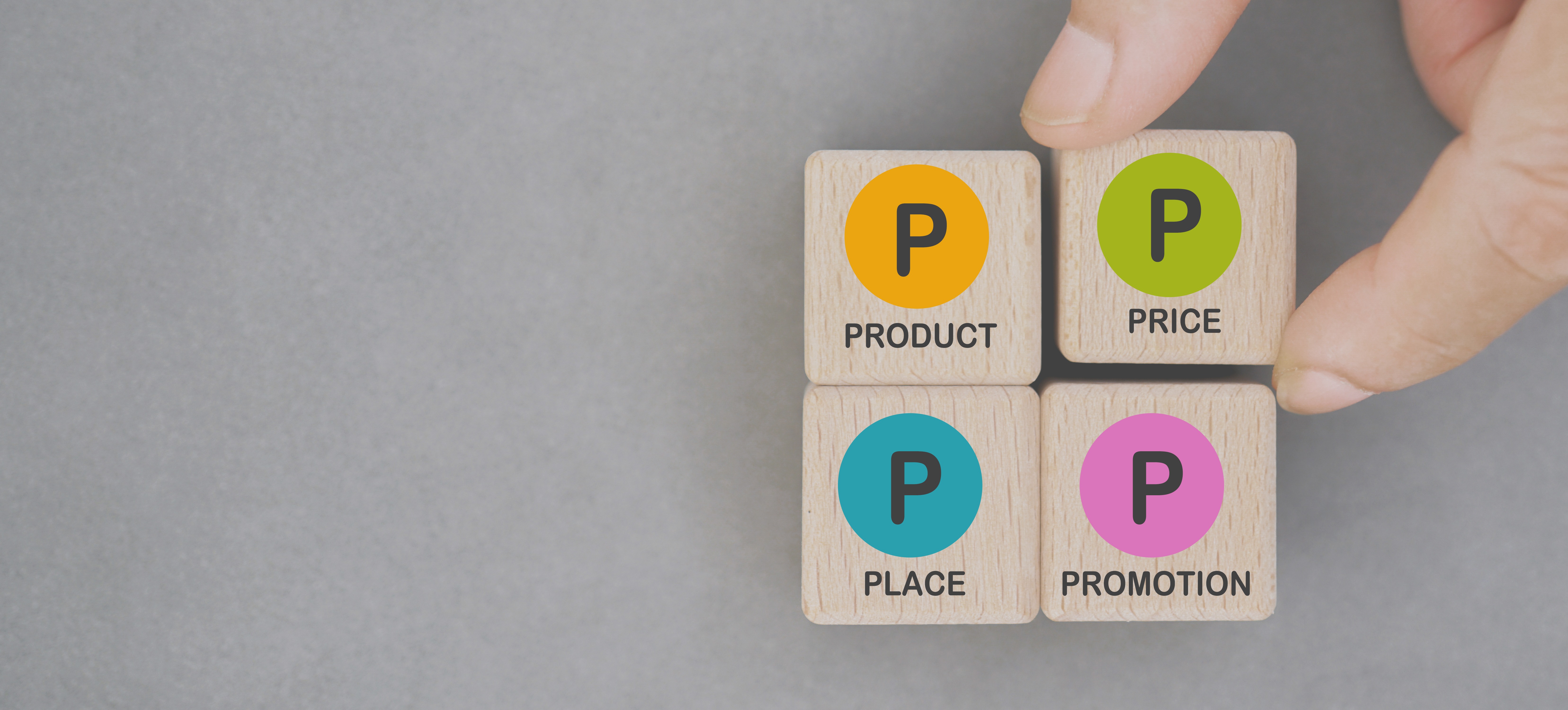 [Featured Image] A person is four moving blocks labeled with the four Ps of marketing: product, price, place, and promotion.
