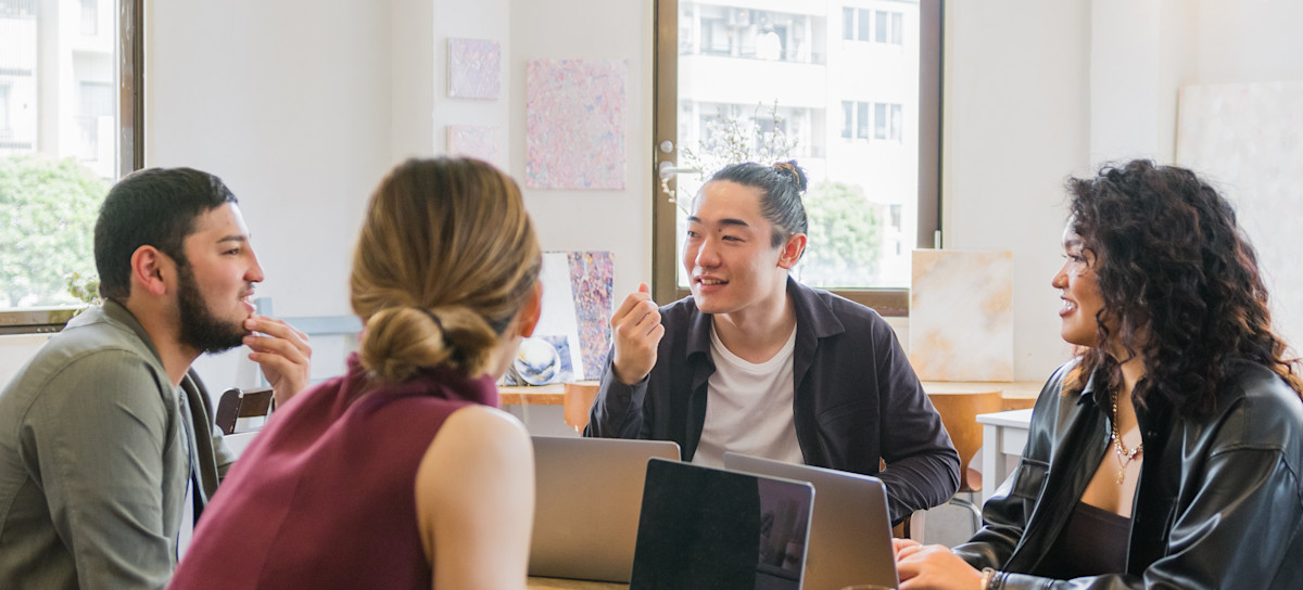 [Featured Image] Four members of a DevOps team discuss their CI/CD pipeline and how to refine the team’s overall strategy. 
