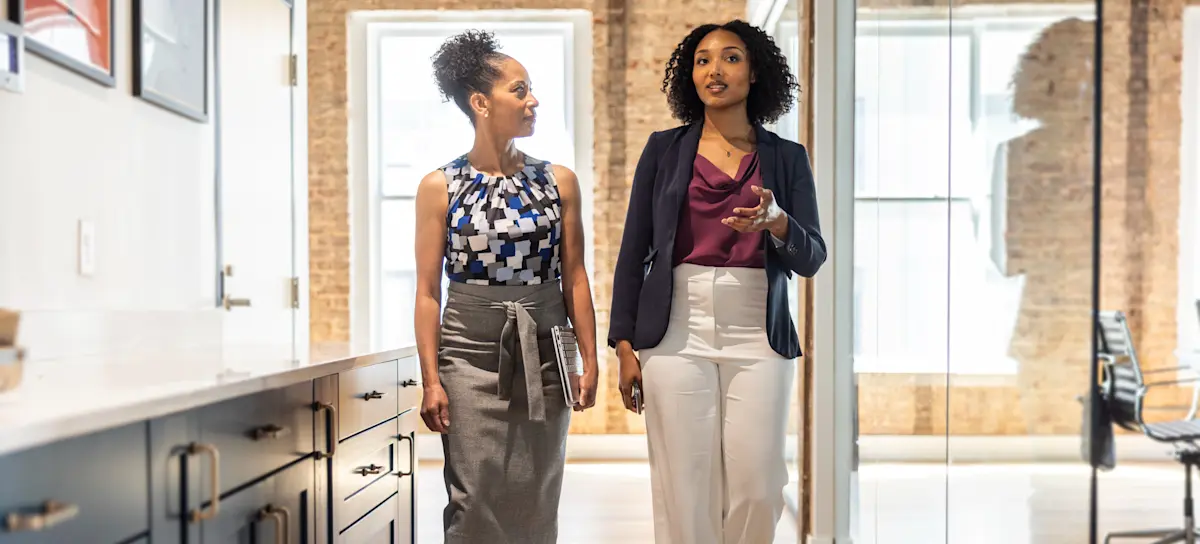 [Feature Image] An aspiring HR professional meets with their mentor to discuss potential SHRM jobs and how to qualify for them.
