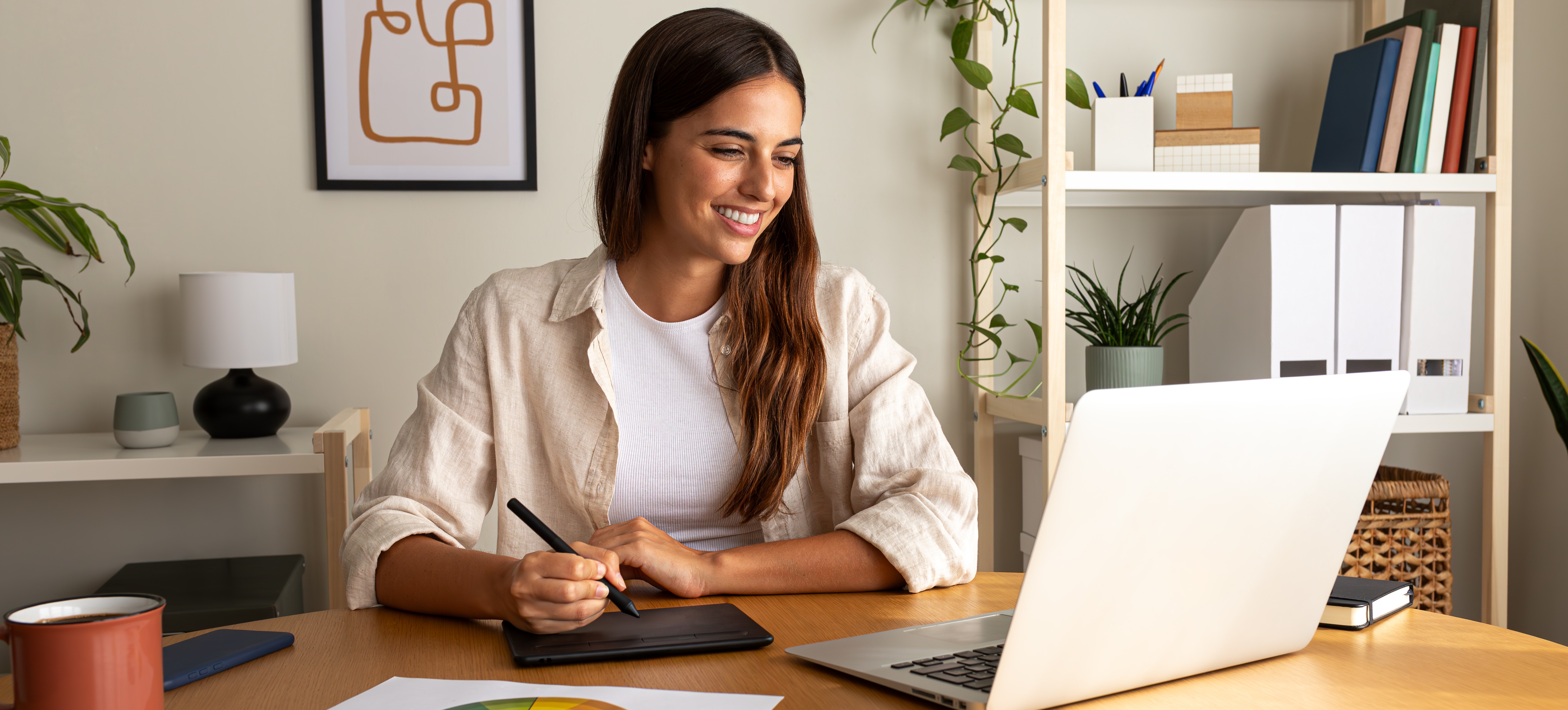 [Feature Image] An aspiring graphic designer researches the typical graphic design career path as they plan their educational and professional journey.
