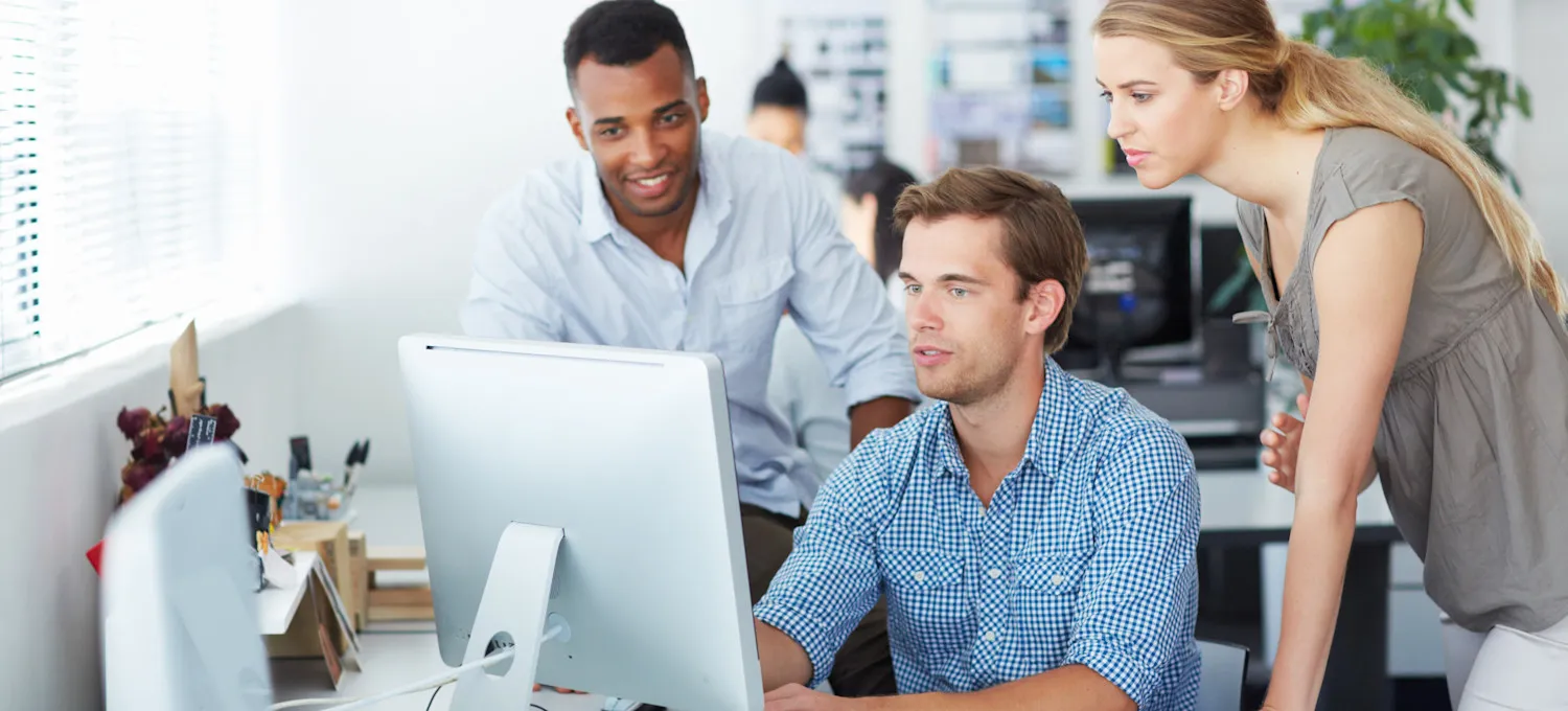 [Featured Image] Three machine learning professionals look at a computer screen in an office setting and discuss scaling laws for neural language models.
