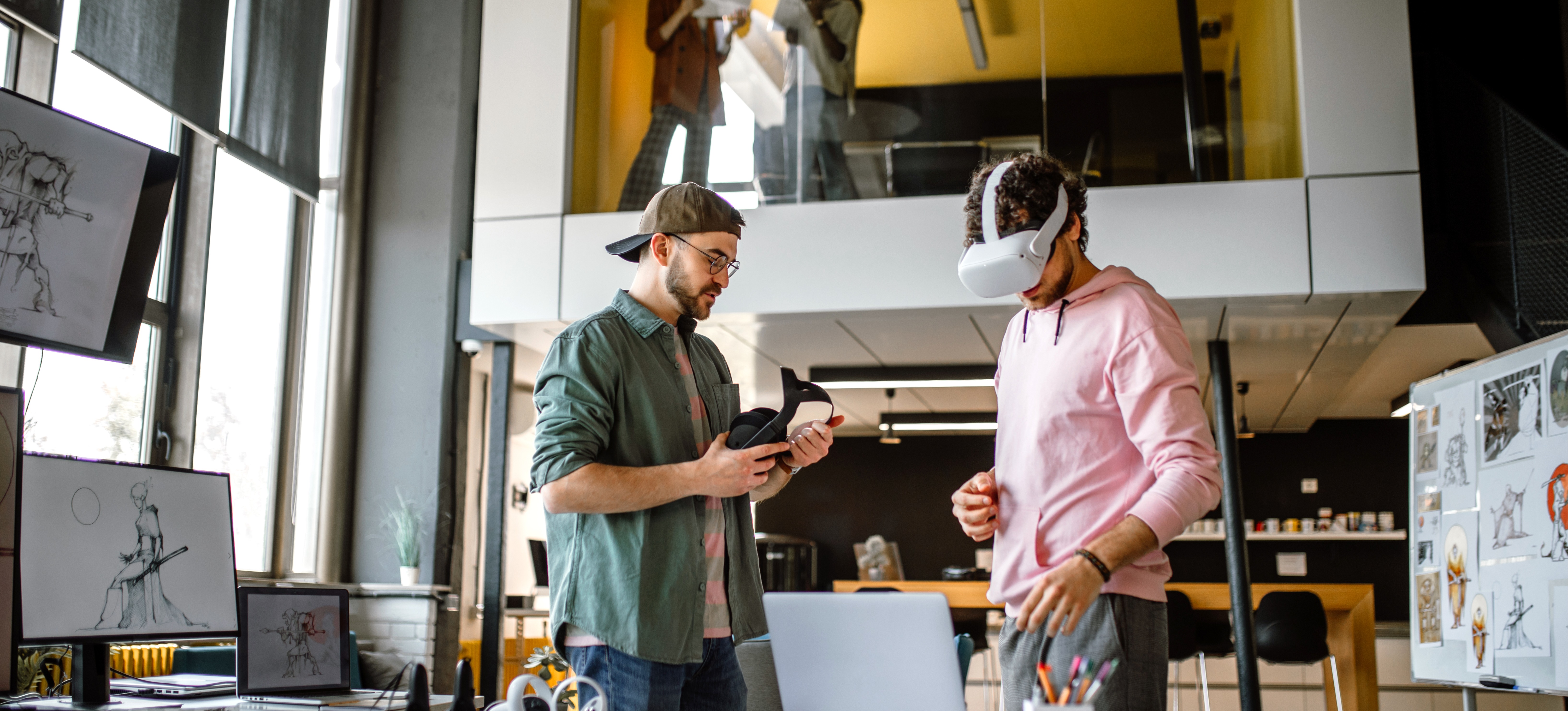 [Featured Image] Two VR developers use computer vision algorithms as they test their creations in a lab environment. 
