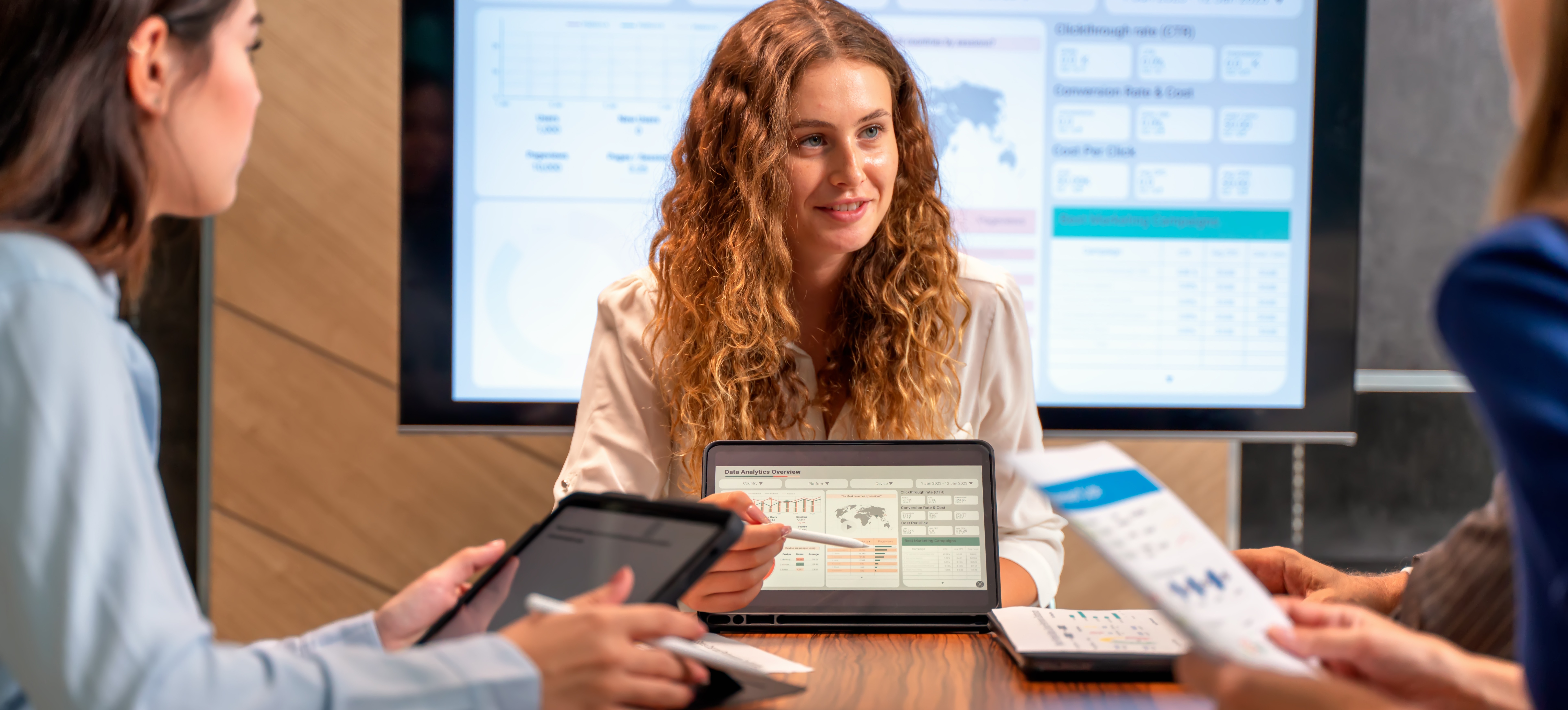 [Featured Image] A data analyst giving a presentation in an office meeting room.