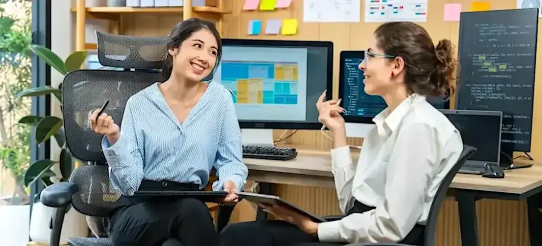 [Featured Image] Professionals working with AI discussing the differences between generative AI and agentic AI in a modern office environment.
