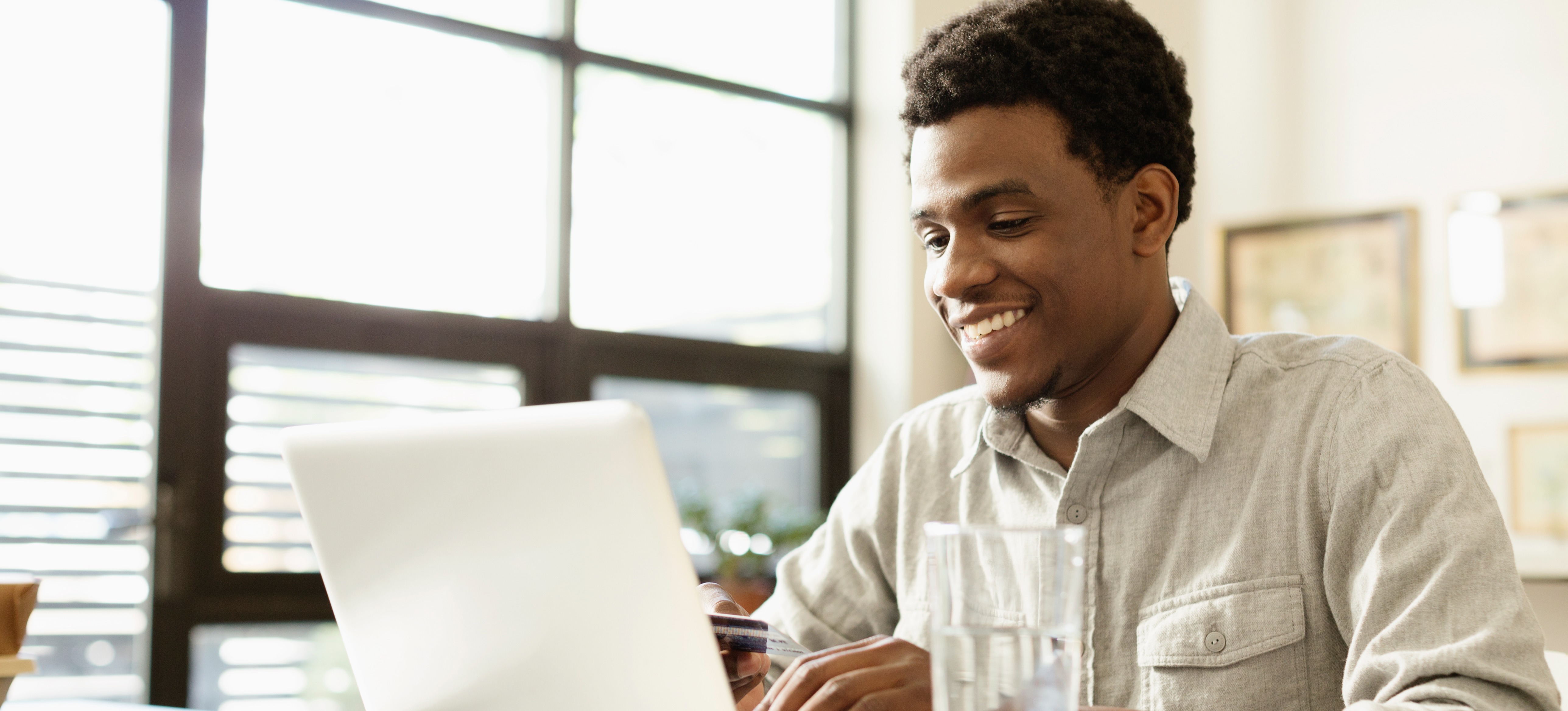 [Featured image] A person sits at a laptop earning their RHCSA certification.
