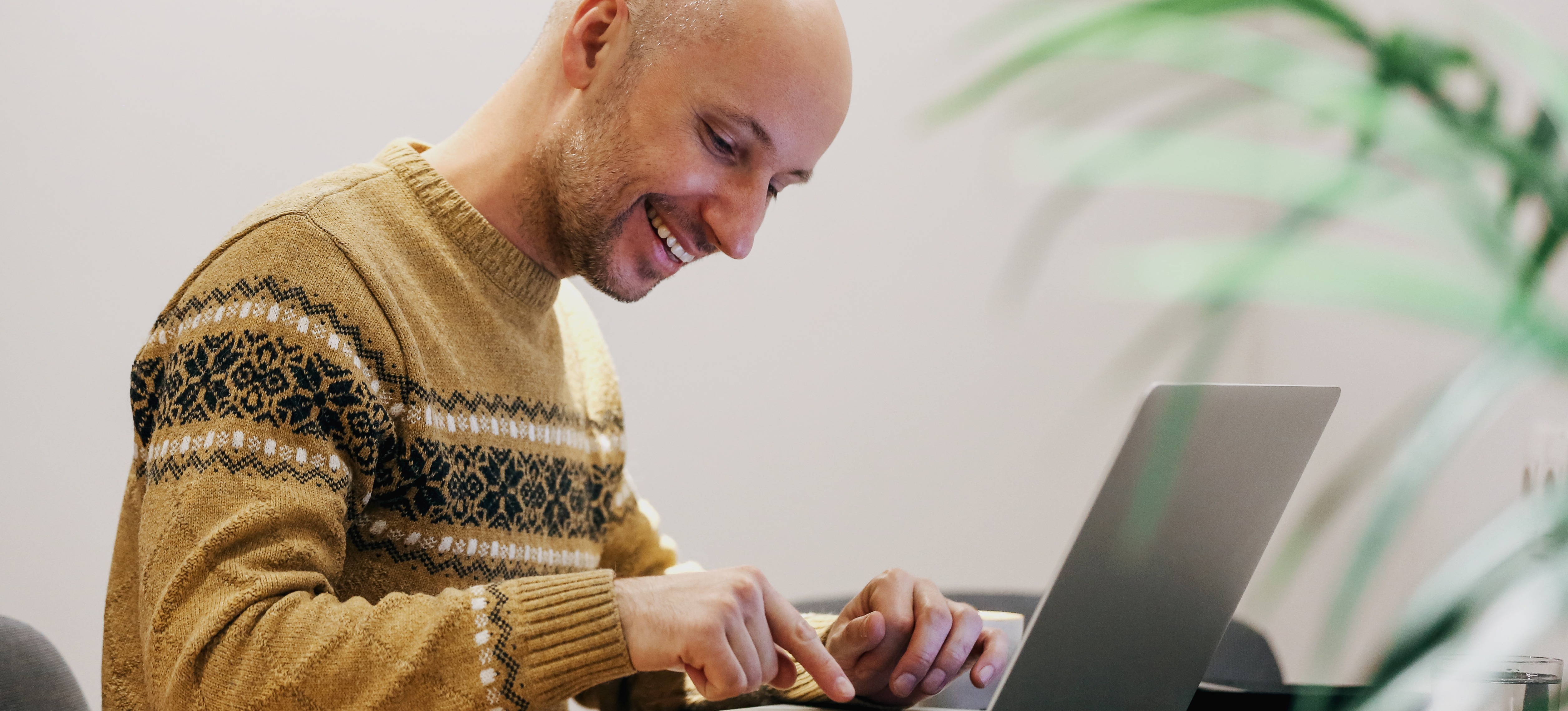 [Featured Image] A person sits at a laptop learning about hidden layers in neural networks during an online course.