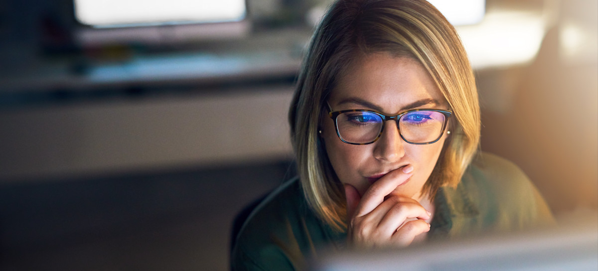 [Featured Image] A data analyst ponders as they look at their computer screen and learn about exploratory data analysis in R.