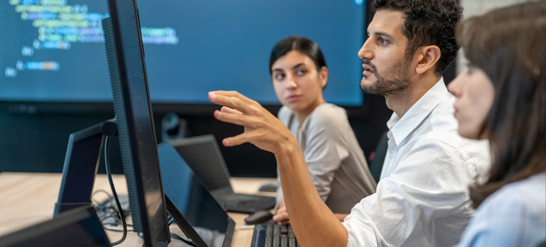 [Featured Image]: A team works together to strengthen data security using quantum-resistant cryptography solutions.
