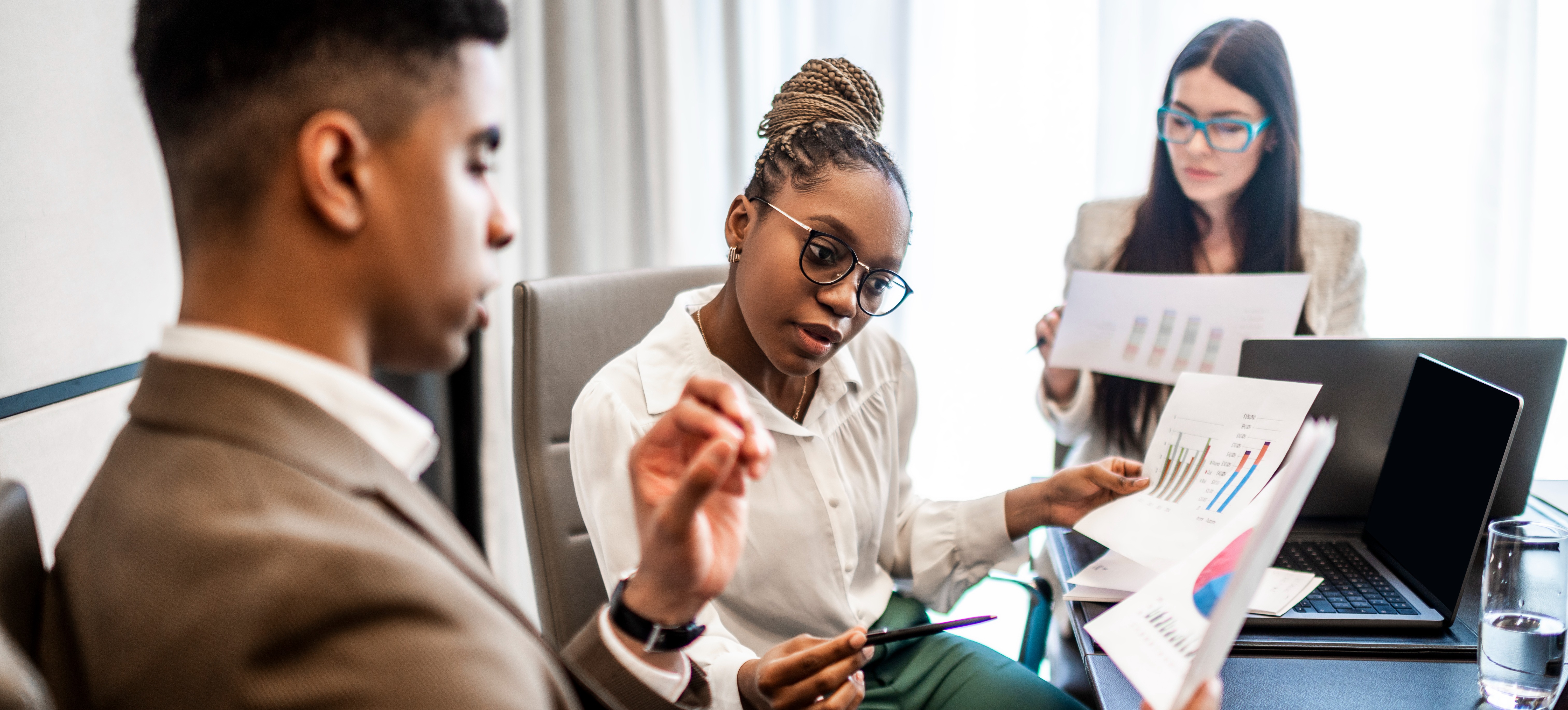 [Featured Image] A data consultant makes strategic recommendations to their colleagues. 