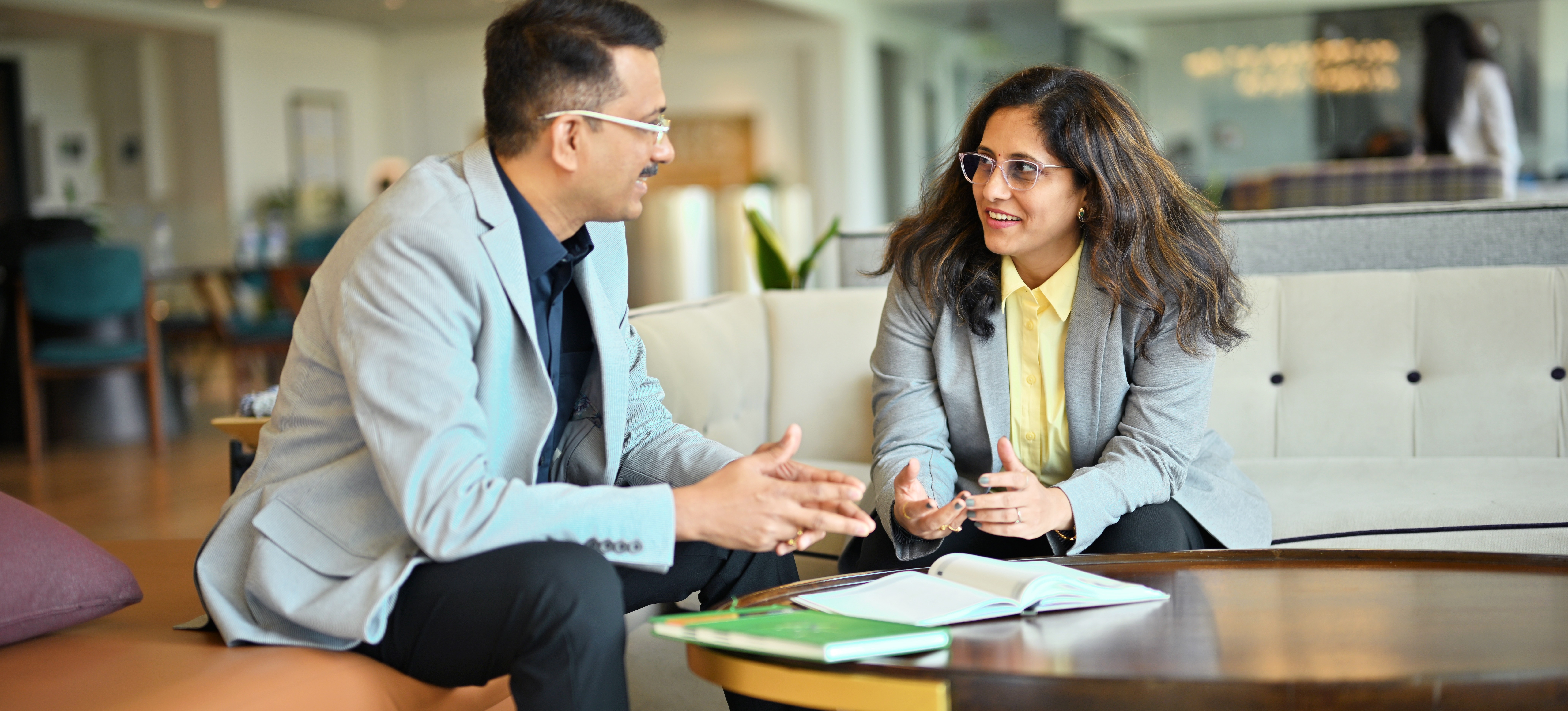 [Featured Image]: A learner listens to advice from a career coach about how to transition into a role.
