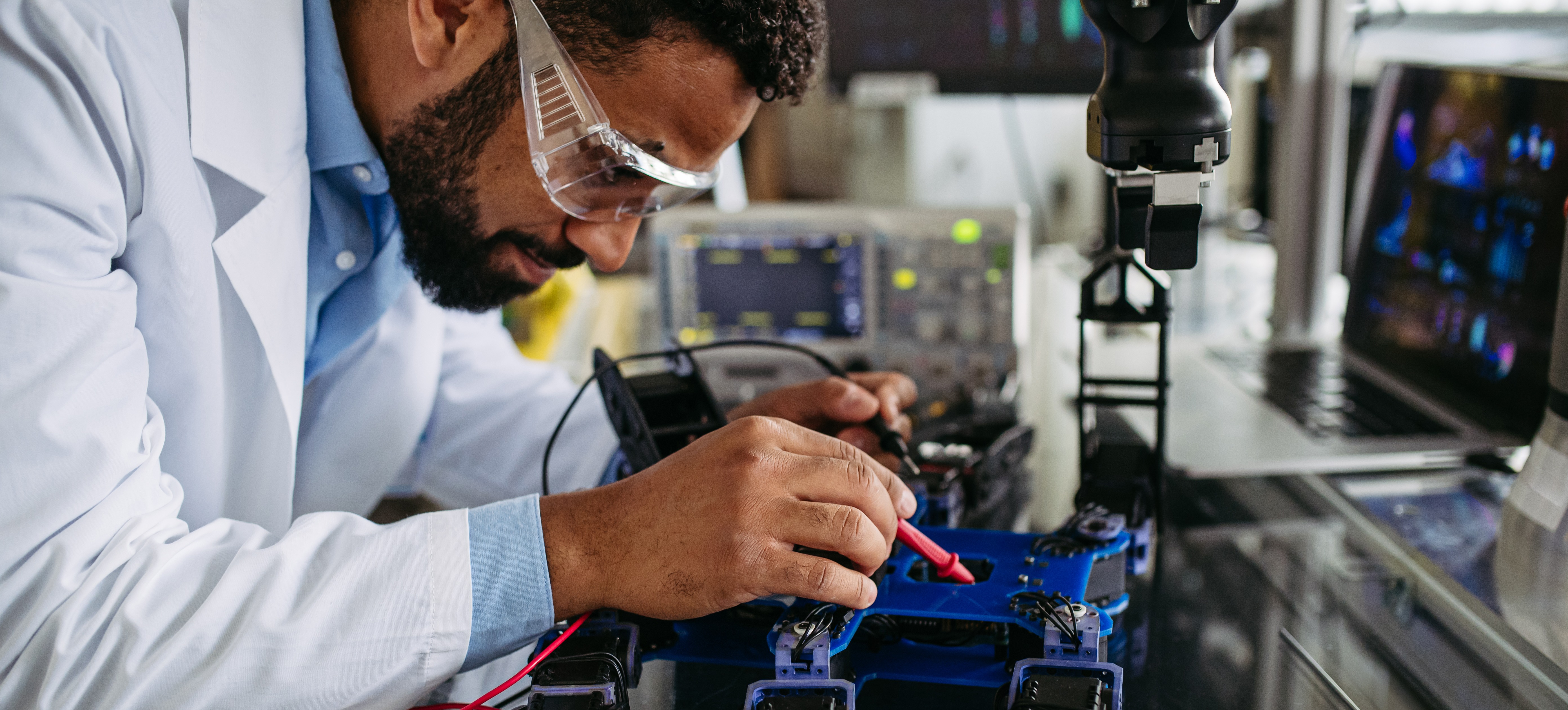 [Featured image] An AI trainer is programming a machine to learn how to read and respond to the data sets sent to it.
