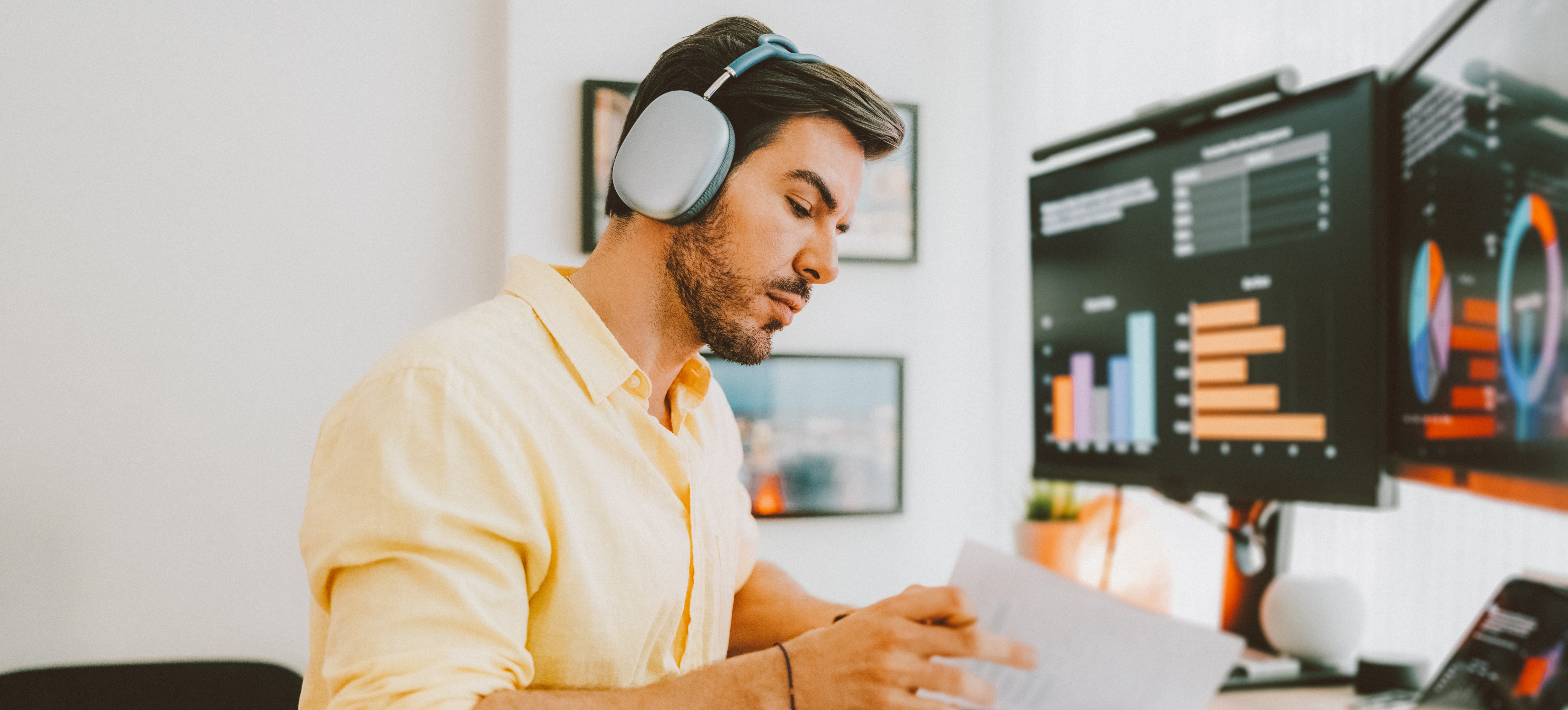 [Featured image: A statistician working at a desk while wearing headphones, using statistical methods to organize data.] 
