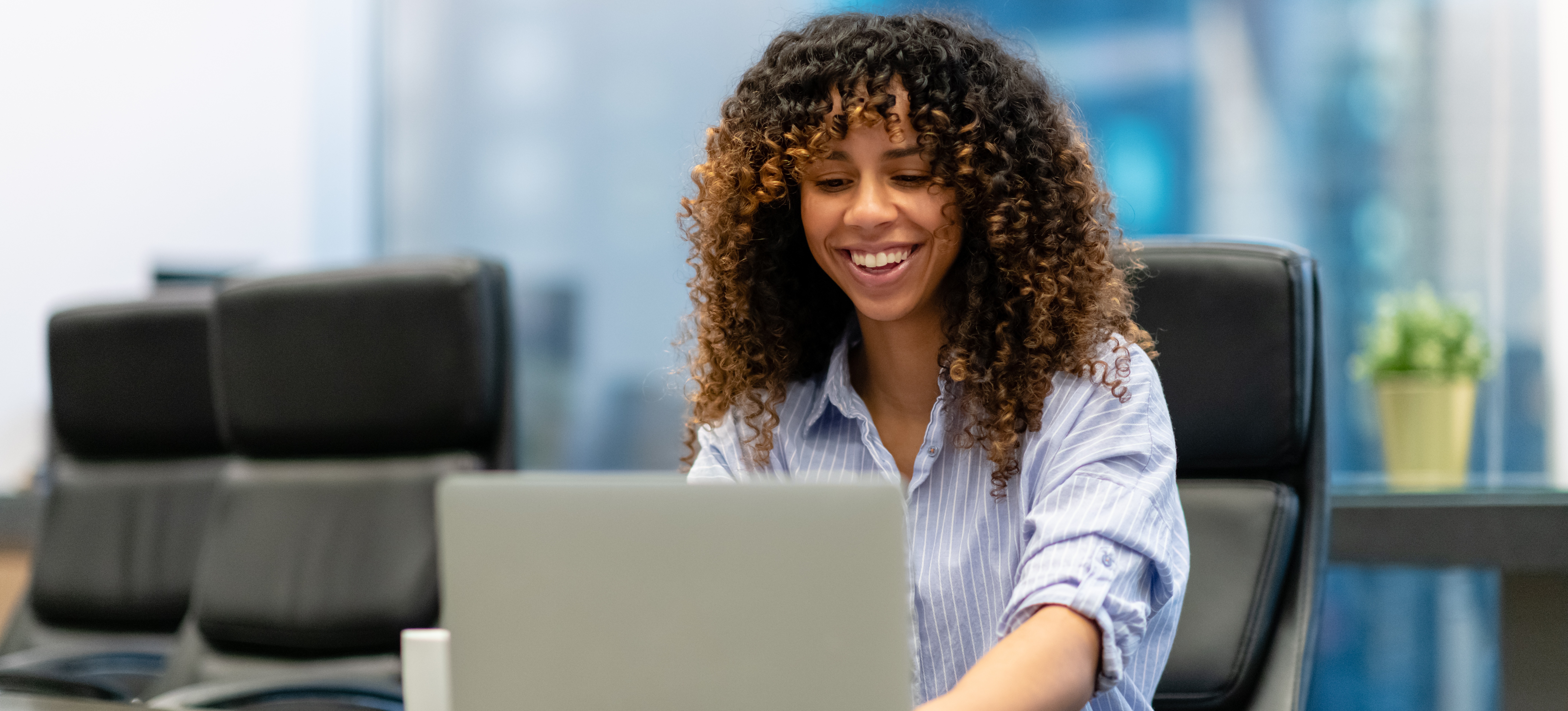 [Featured Image] A worker in marketing is excited by the benefits of AI in their workflow. 