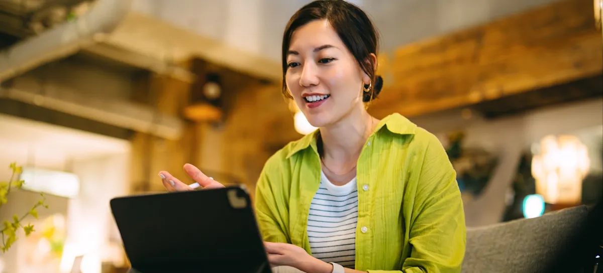 [Featured Image]: A person uses a tablet to explore how ChatGPT generates responses to various prompts.
