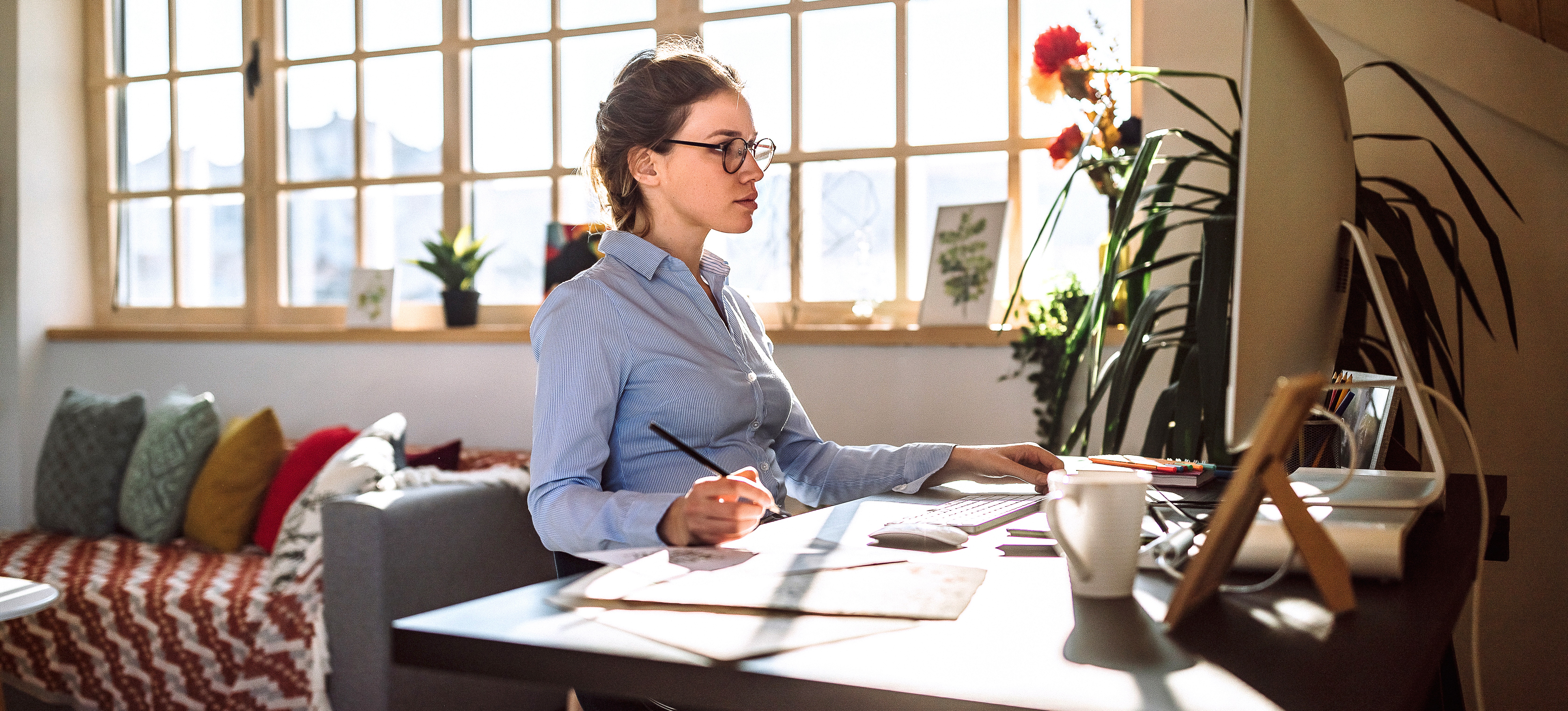 [Featured image] Woman at a workstation working on a professional development course