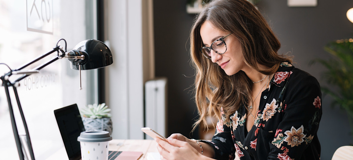 [Featured image] Social media marketer reviews post performance for a client.