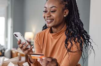 [Featured Image] A woman interacts with a chatbot while shopping online, an example of artificial intelligence.