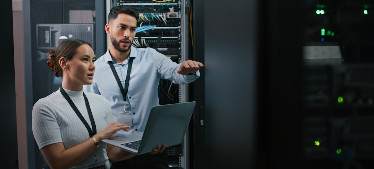 [Featured Image] Two network engineers discuss the best approach for improving an organization’s network.
