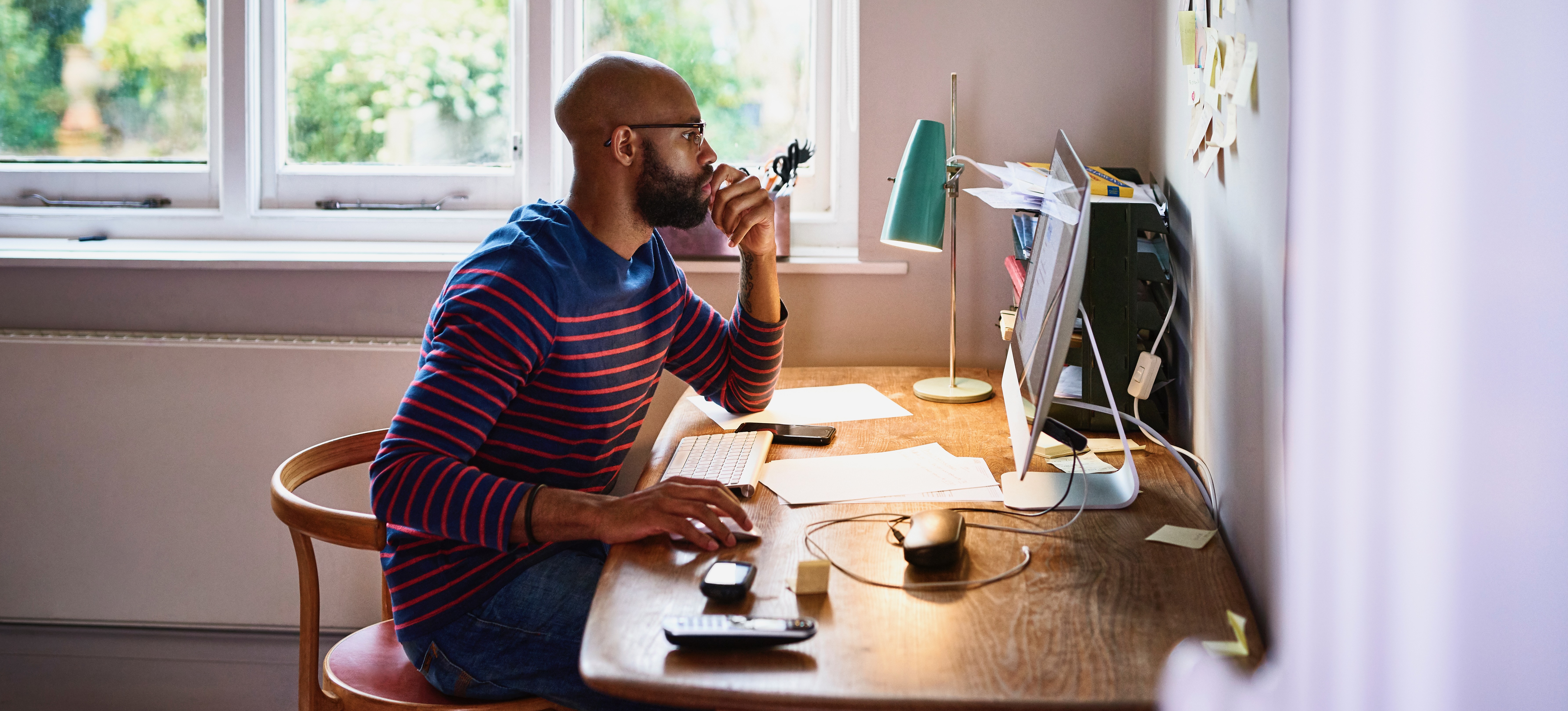 [Featured Image] A Java software developer sits at their desk and studies for a Java certification exam.