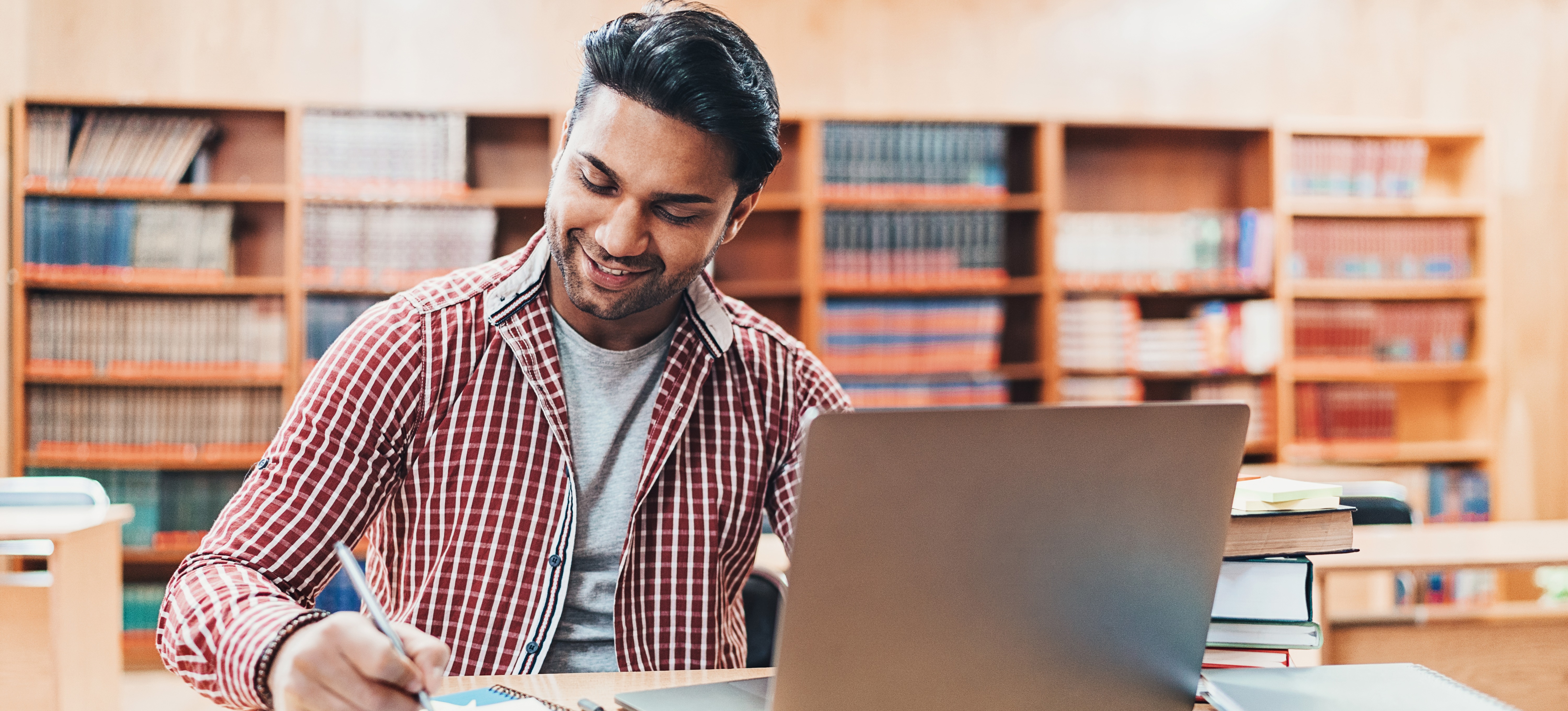 [Featured Image] A prospective engineer researches SRE vs. DevOps to choose the role that best meets their goals and skill set. 
