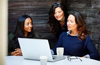 [Featured image] A businesswoman is discussing a proposal on her laptop with her two other colleagues.
