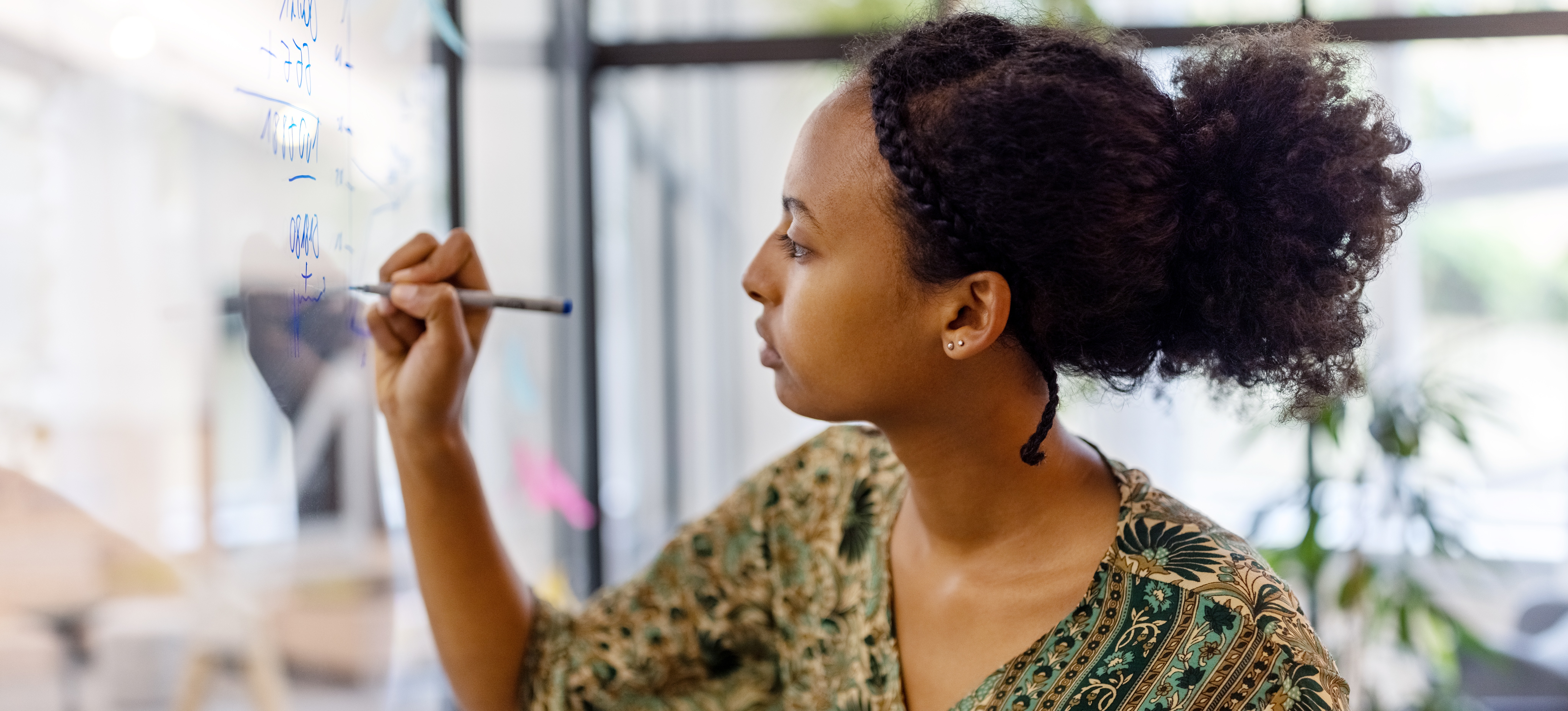 [Featured Image] A professional overcomes the Einstellung Effect while brainstorming ways to find a solution to a pressing problem.
