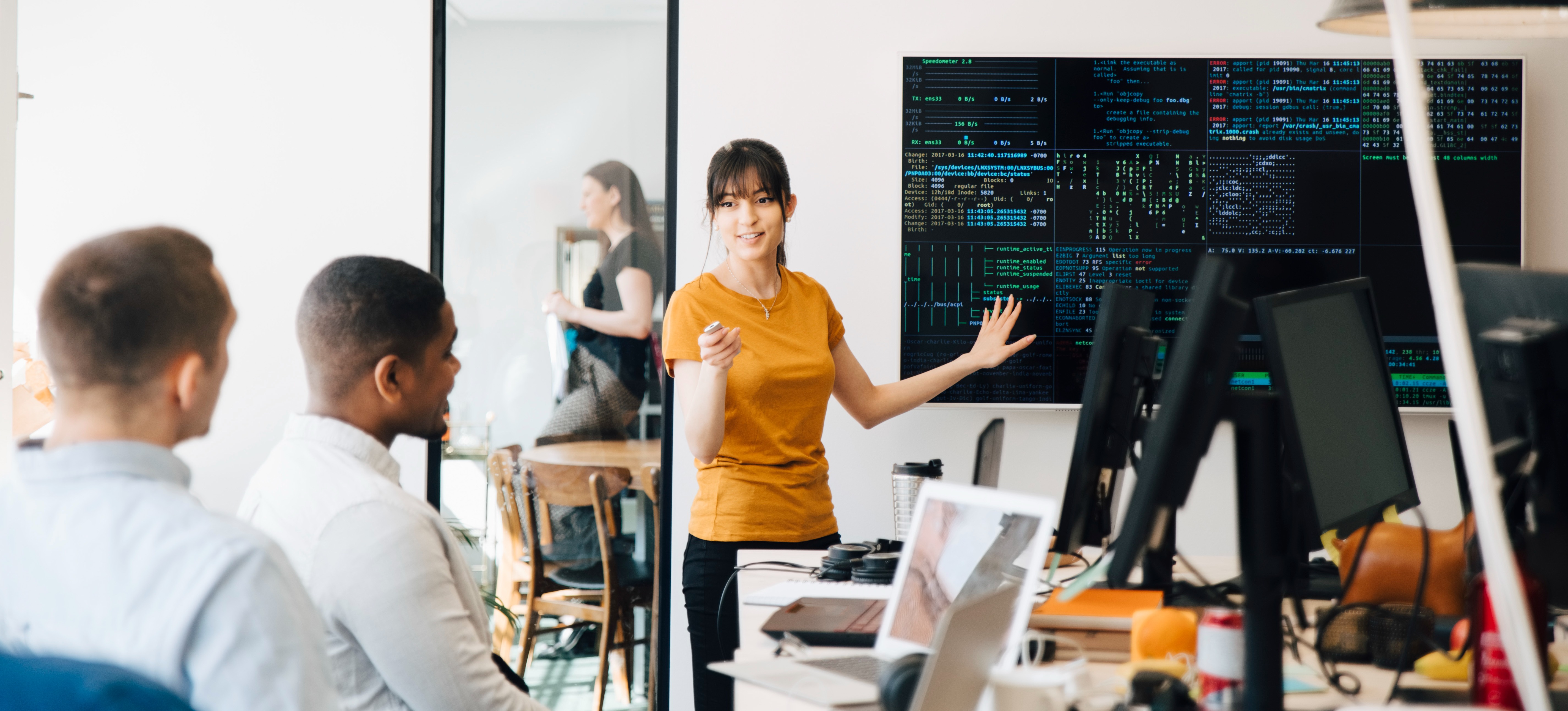 [Featured Image] A computer programmer is teaching their peers different PHP projects they can do to improve their proficiency.