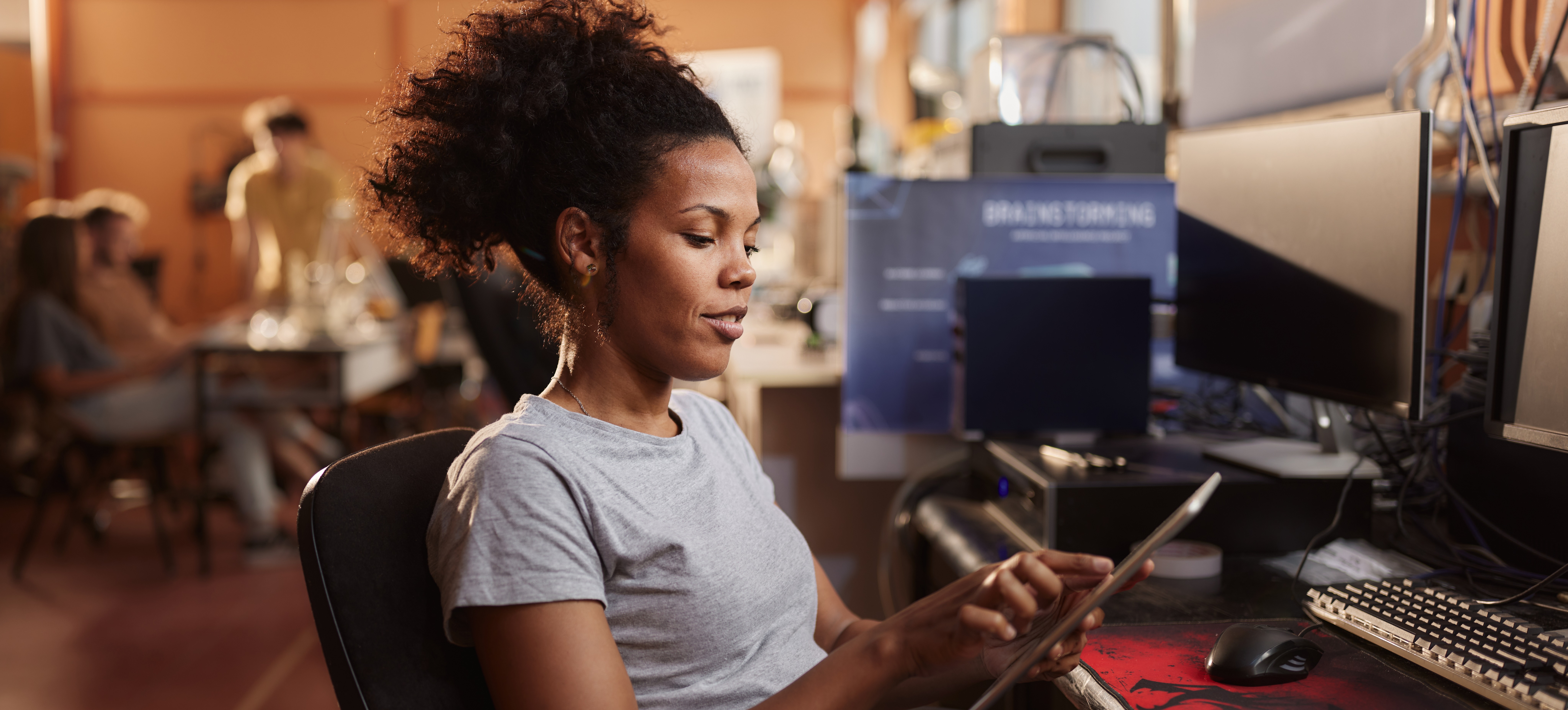 [Featured image] A machine learning engineer using neural network regularization to correct overfitting using a touchpad.