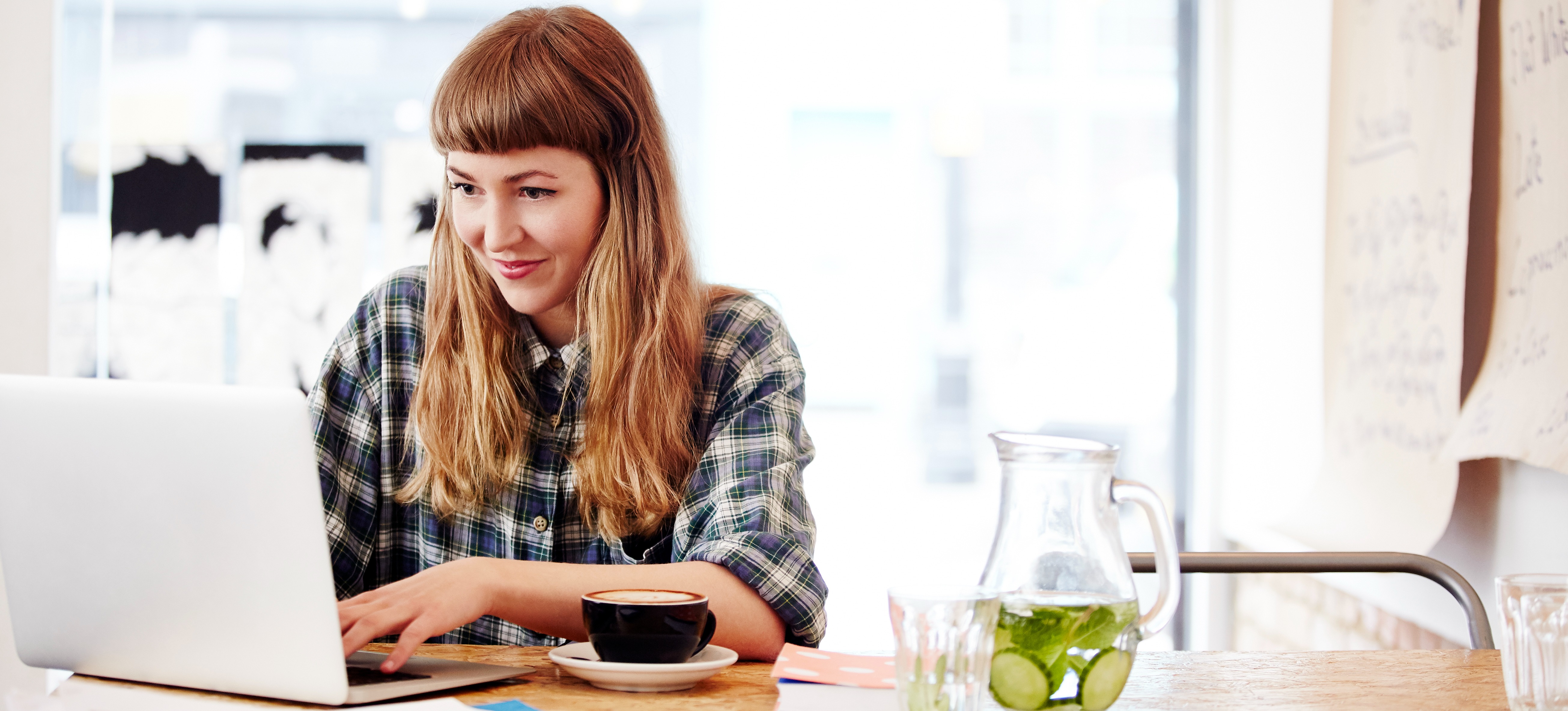 [Featured Image] A programmer works on their laptop to earn a prompt engineering certification.
