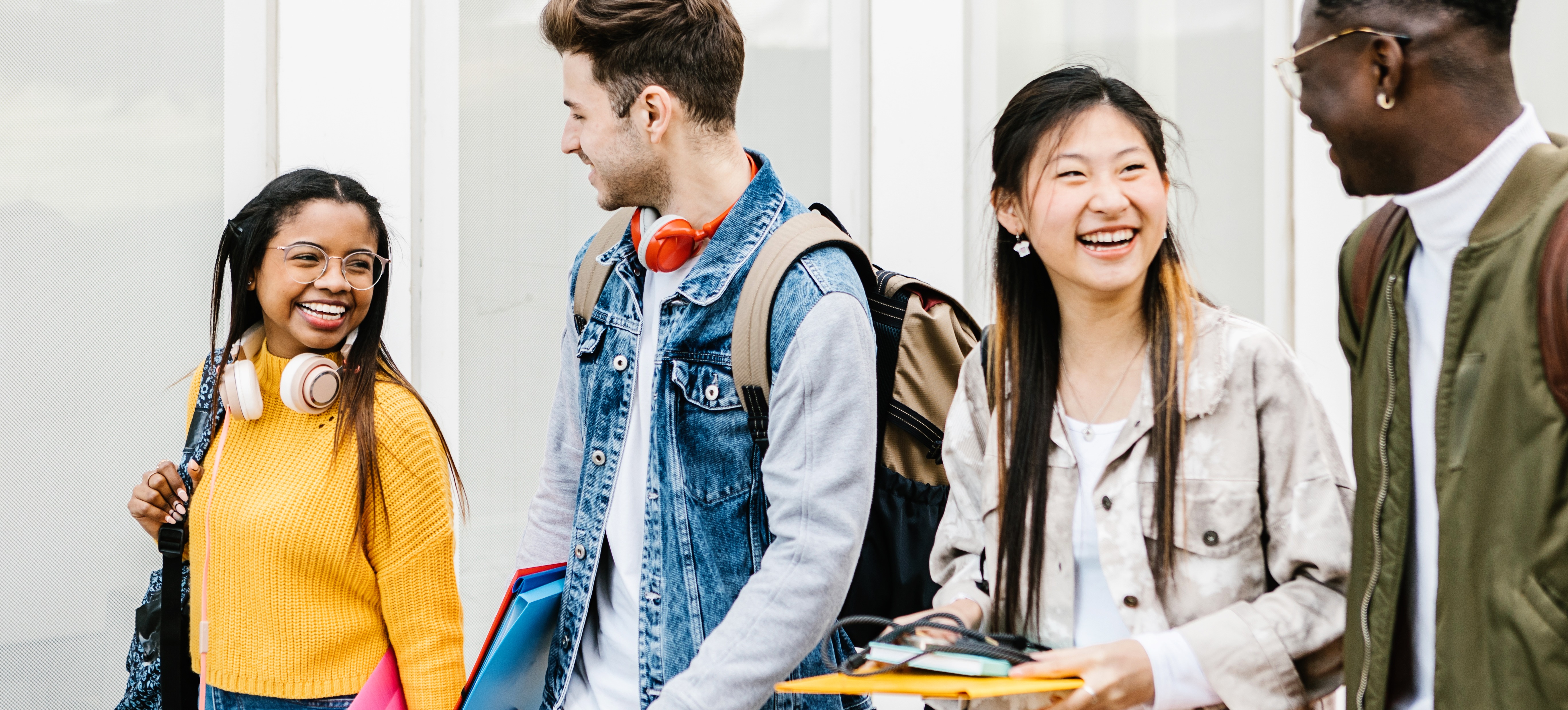 [Featured Image] A smiling group of BTEC and A Level students walk together outside.
