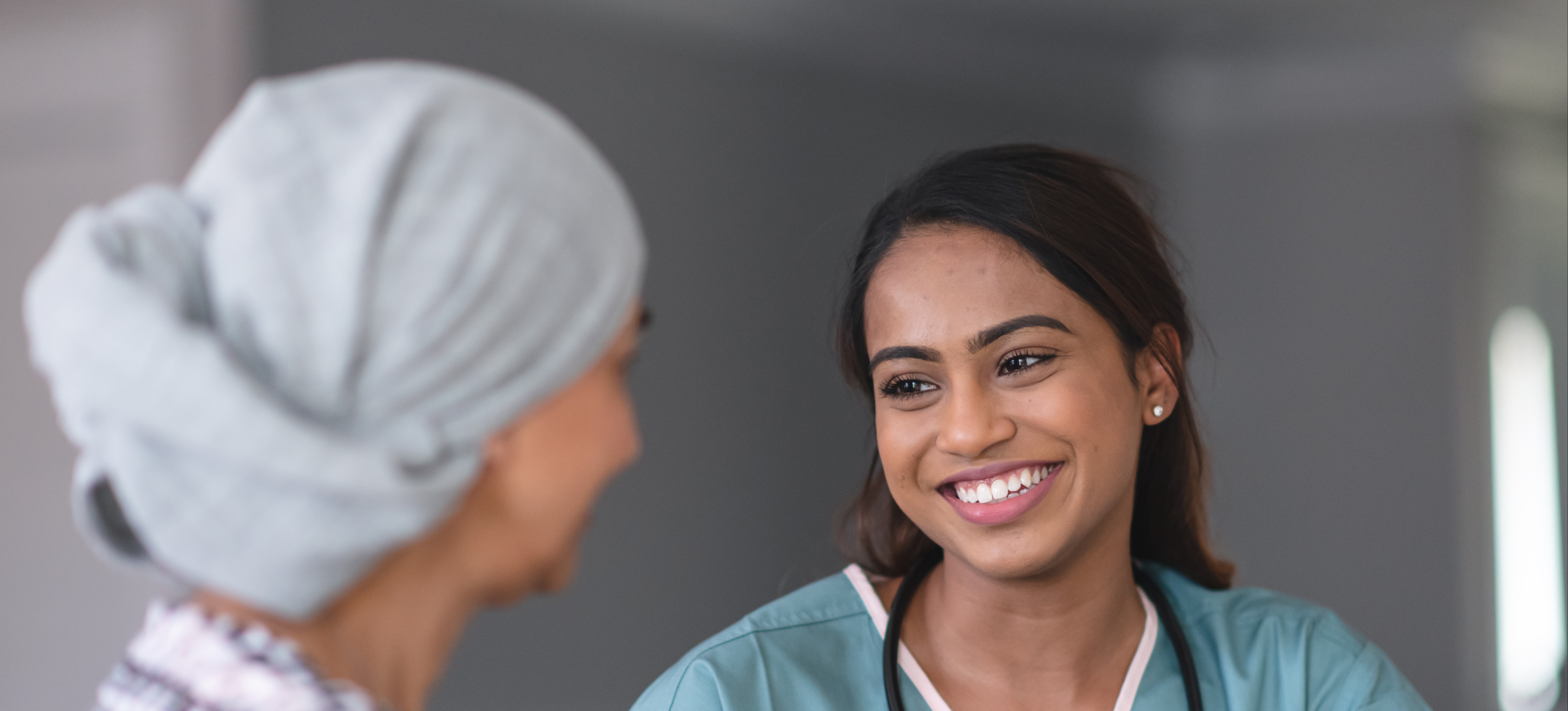 [Featured Image] Advance Practice Registered Nurse,  consulting with a patient. 