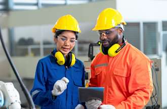 [Featured Image]:  Two industrial hygienists are discussing and checking the conditions of the workplace to see if there are hazards that have to be corrected. 