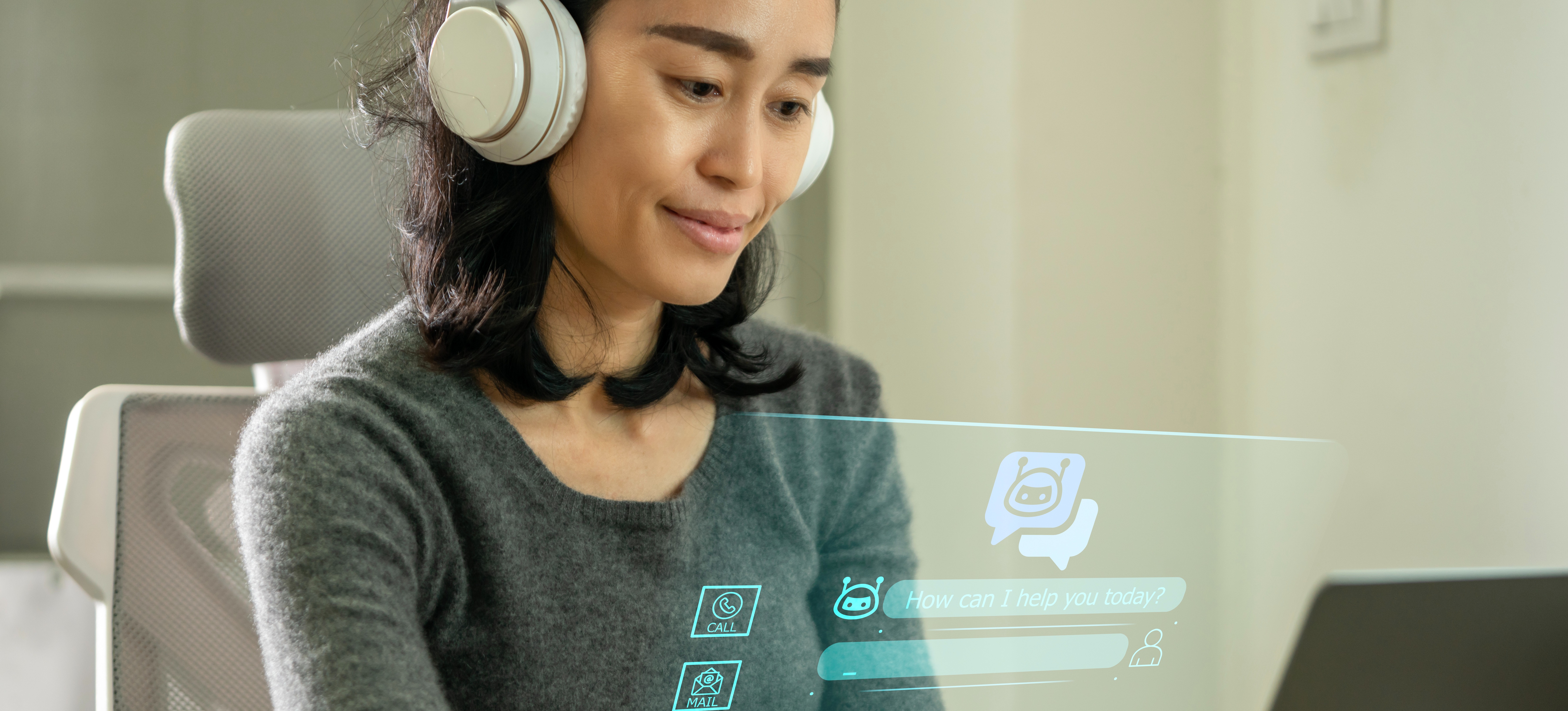 [Featured Image] A person is on their laptop using a customer service artificial intelligence chatbot to answer questions in real-time.
