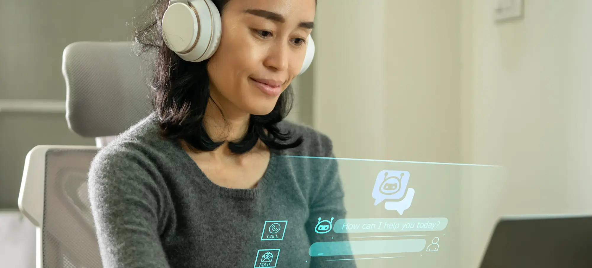 [Featured Image] A person is on their laptop using a customer service artificial intelligence chatbot to answer questions in real-time.
