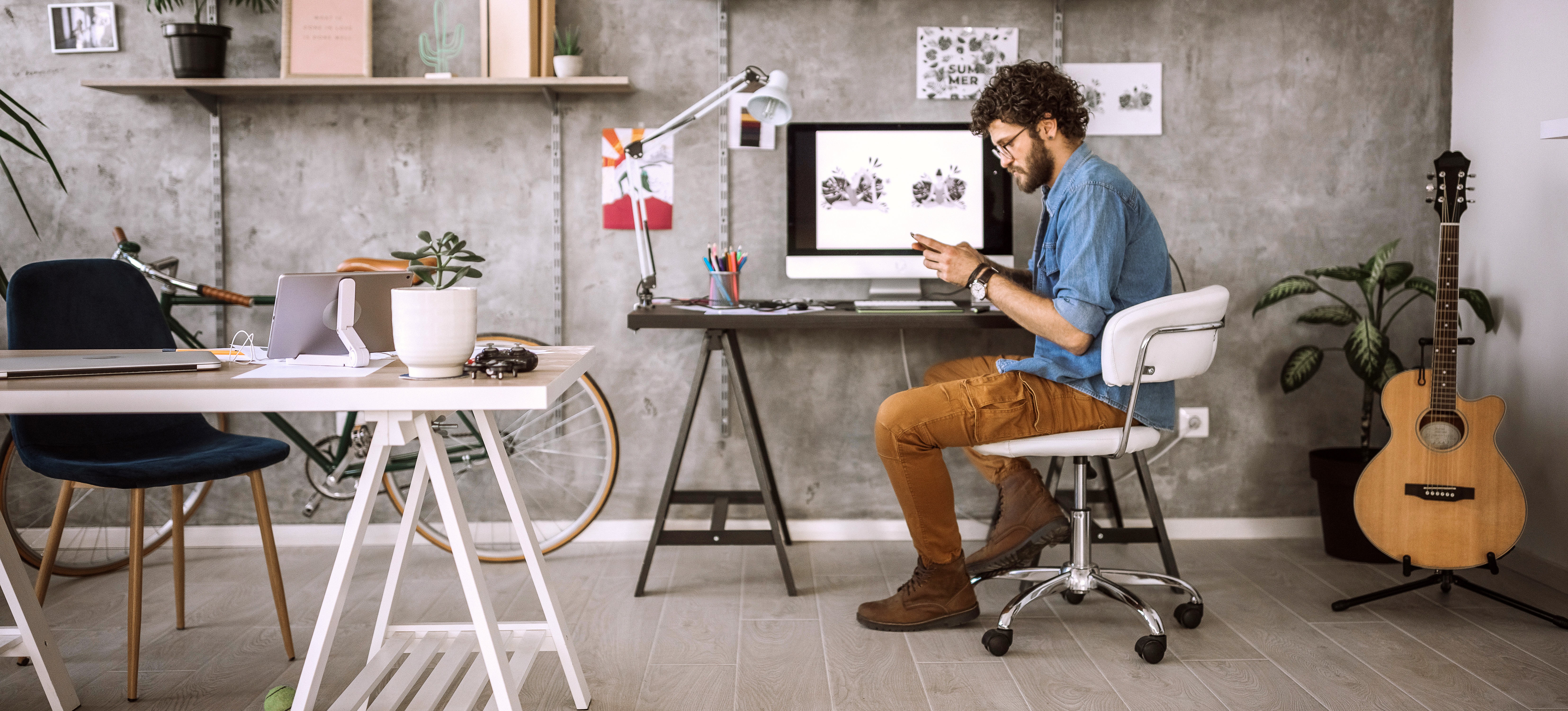 [Featured Image] A designer takes a short break from using graphic design tools while working on their latest project. 
