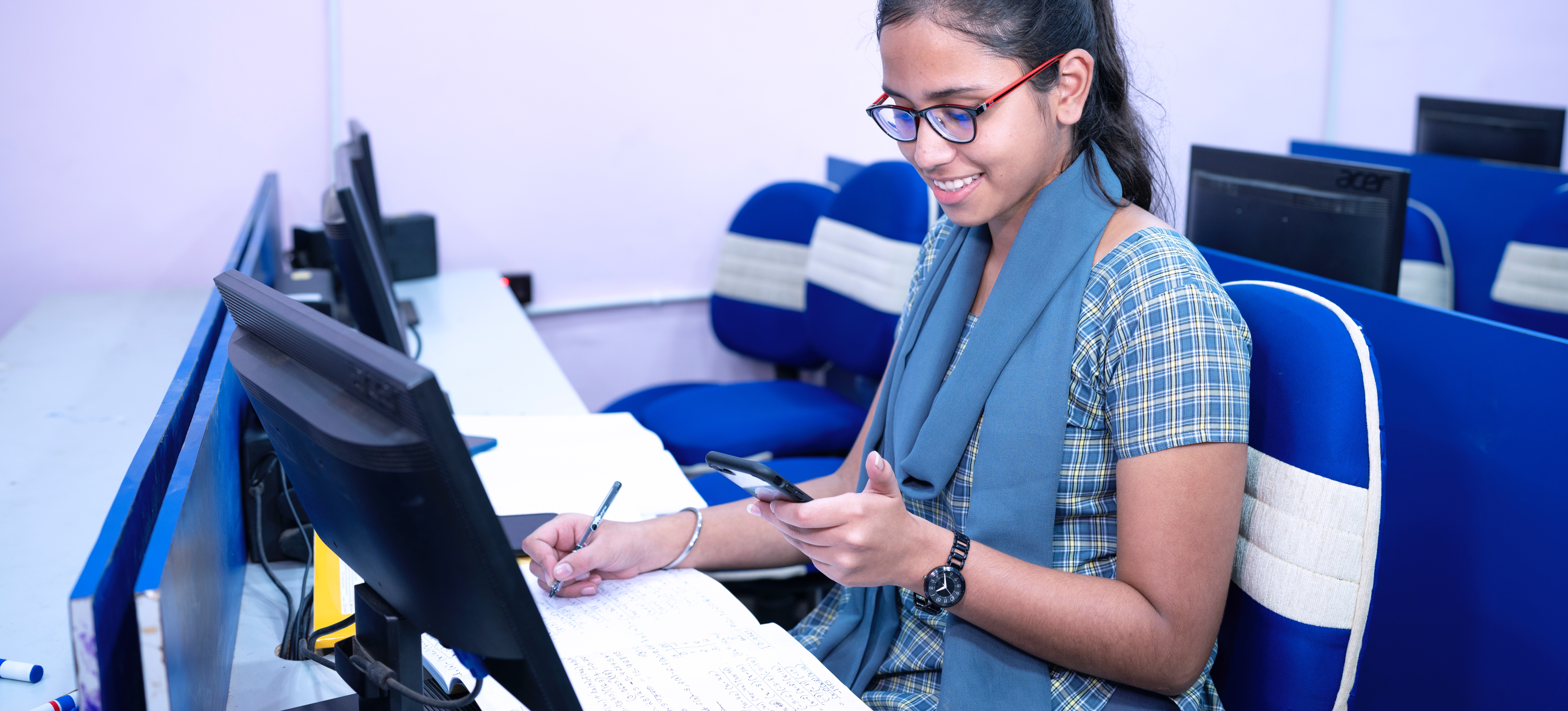 [Featured Image]: A college student searches for an answer to the question 'GMAT vs GRE: Which should I take?' as they prepare to apply to a postgraduate programme.