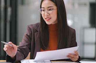 [Featured image] A businessperson performs k-means clustering to gain insights during exploratory data analysis.
