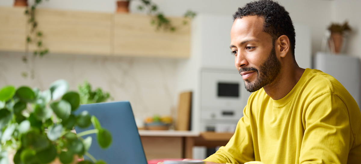 [Featured Image] A business owner uses computer to make a shopify test order