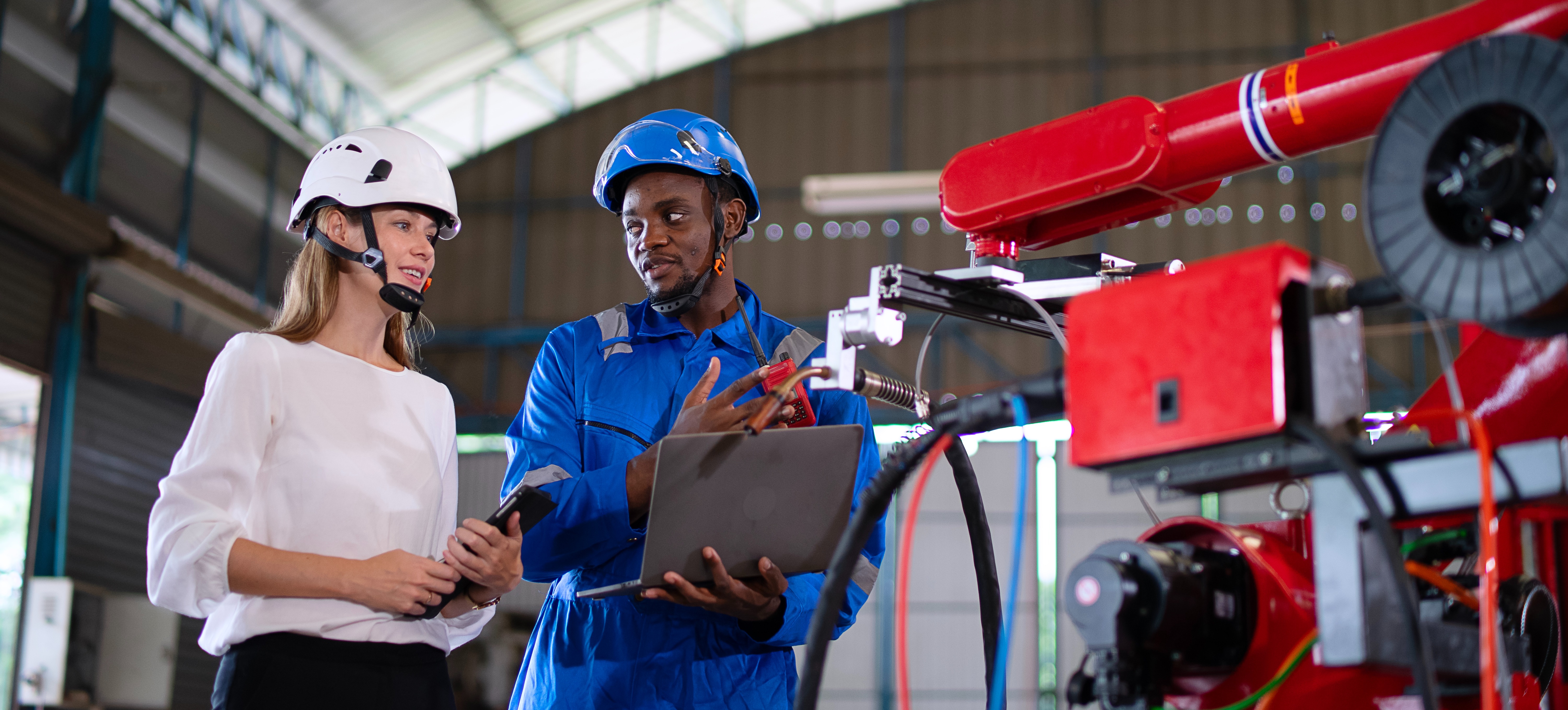 [Featured Image] An automation engineer is sharing their job responsibilities with an intern.
