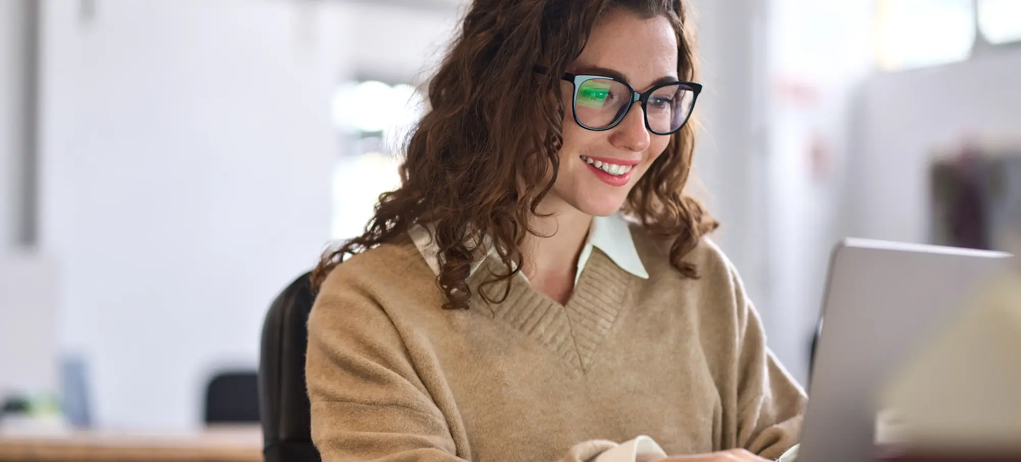 [Featured Image] A learner researches marketing coordinator salary information as they plan their career path in marketing. 
