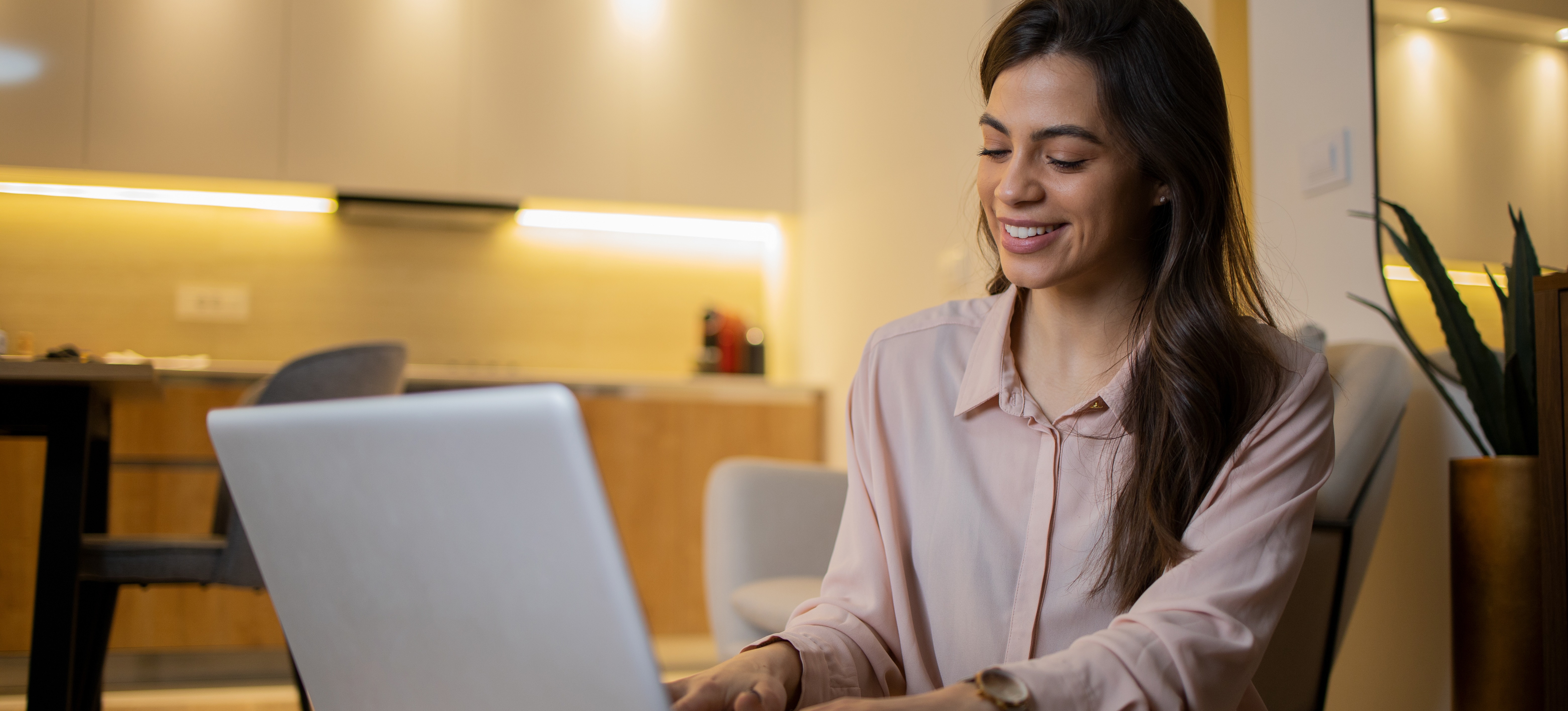 [Featured Image] A data analyst works on a laptop, using predictive analytics to assist their organization with decision-making.
