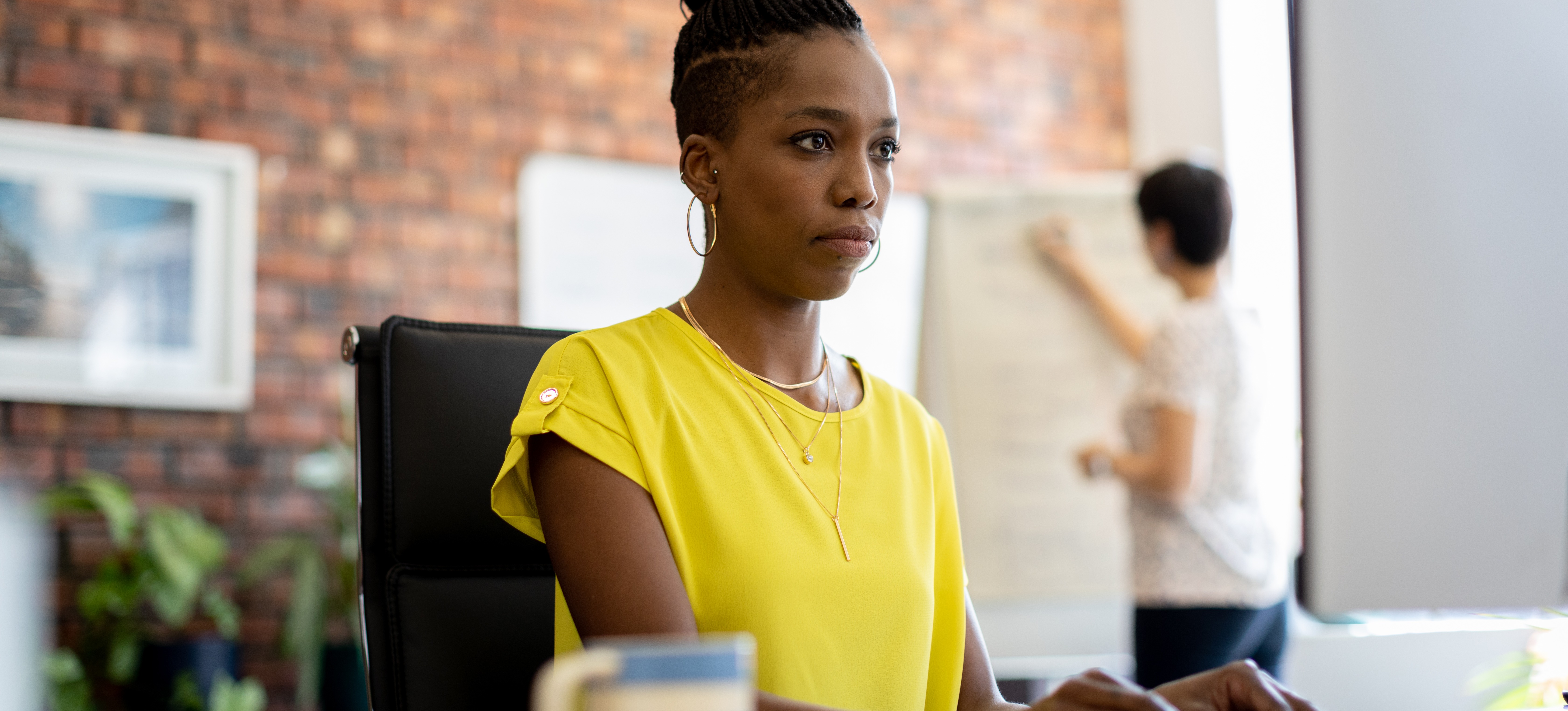 [Featured Image] A programmer works at a computer, utilizing Kotlin to assist in the app development process.
