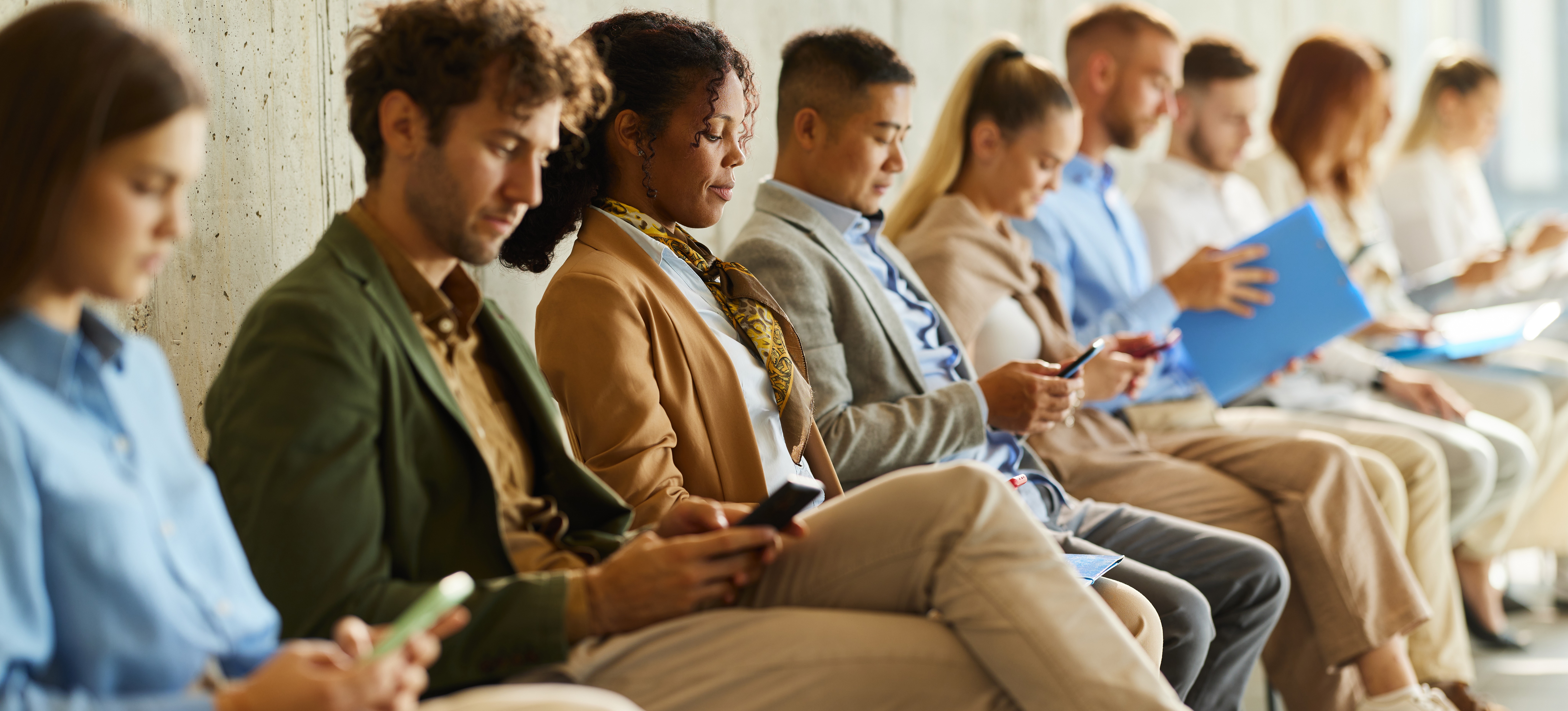 [Feature Image] After preparing to answer OpenAI interview questions, applicants wait to meet with interviewers.
