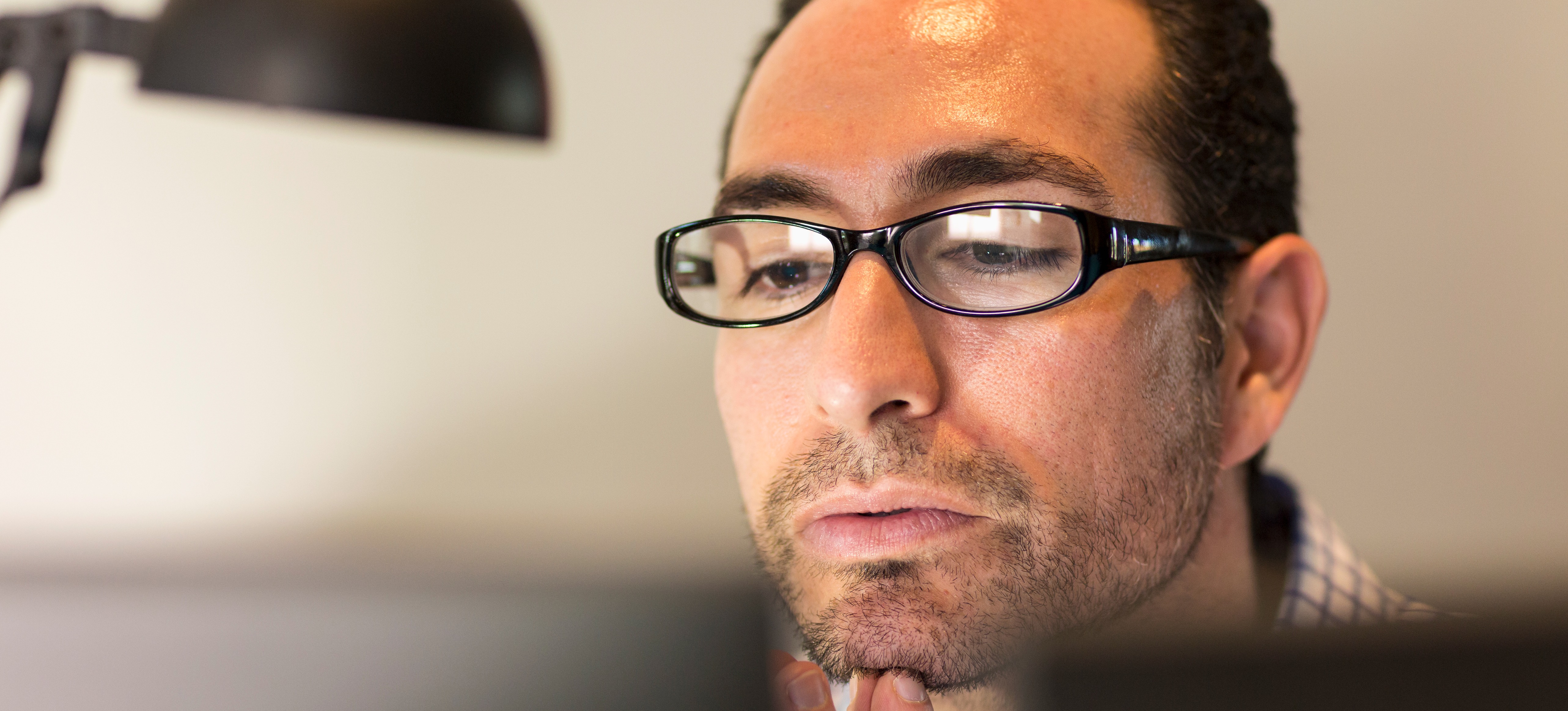 [Featured Image] A male shopify user is closing his shopify store.