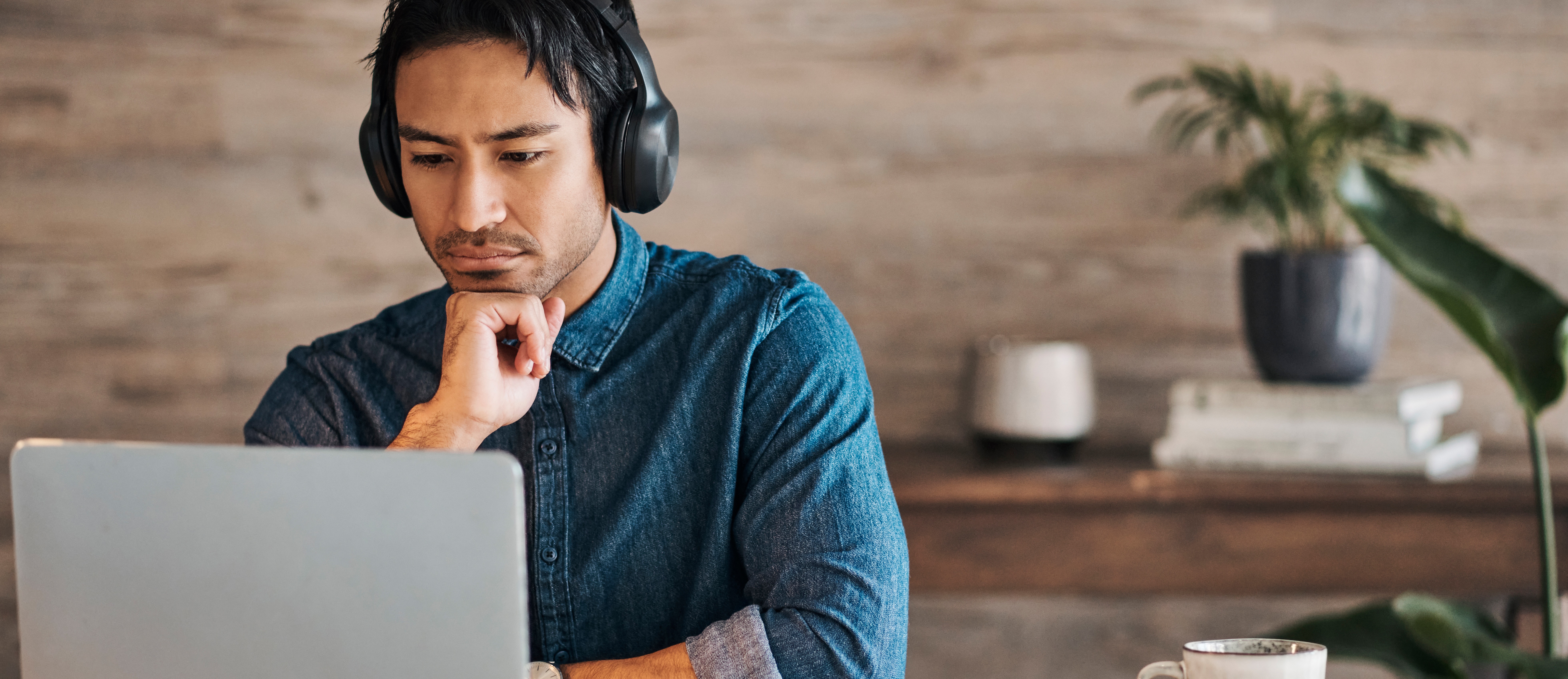 [FEATURED IMAGE] An information technology professional studies for an Azure exam to earn their Microsoft Azure certification.
