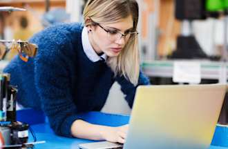 [Featured image] An electrical engineer works on a project with her laptop computer.