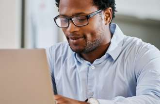 [Featured Image] A machine learning engineer studies a confusion matrix on his laptop.  