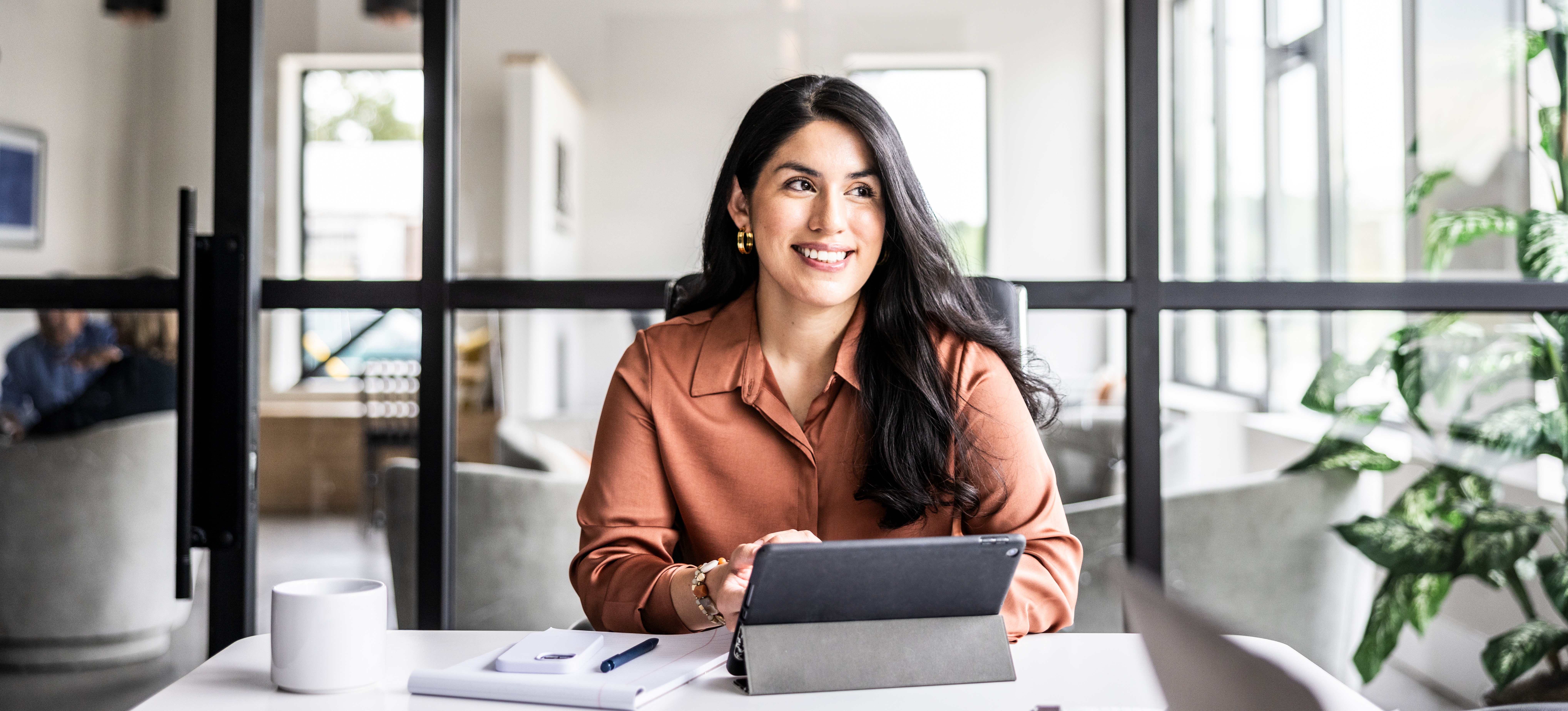 [Feature Image] An aspiring project manager learns how to use Excel and practices on a tablet.
